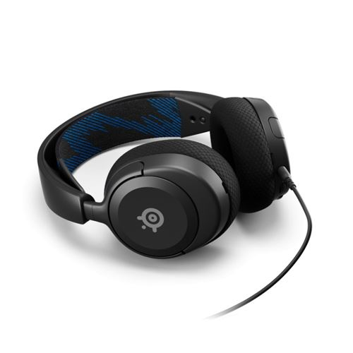 Auriculares negros sobre una superficie blanca. La diadema tiene un patrón azul y negro.