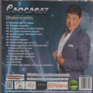 Egy autó multimédia rendszer képernyője, tájképpel, alkalmazásikonokkal az alján.