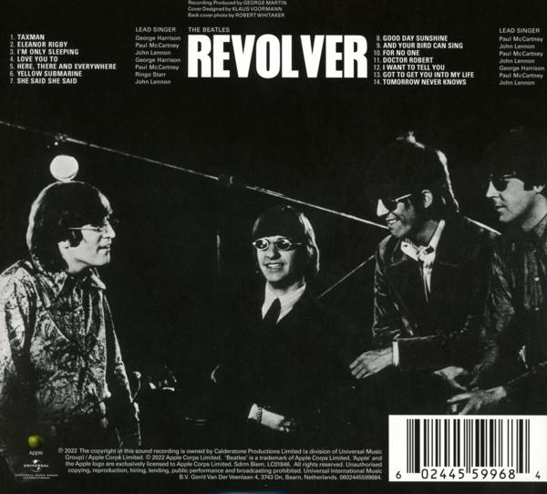 Albumcover von The Beatles' Revolver. Vier Männer in Anzügen in einer schwach beleuchteten Umgebung.