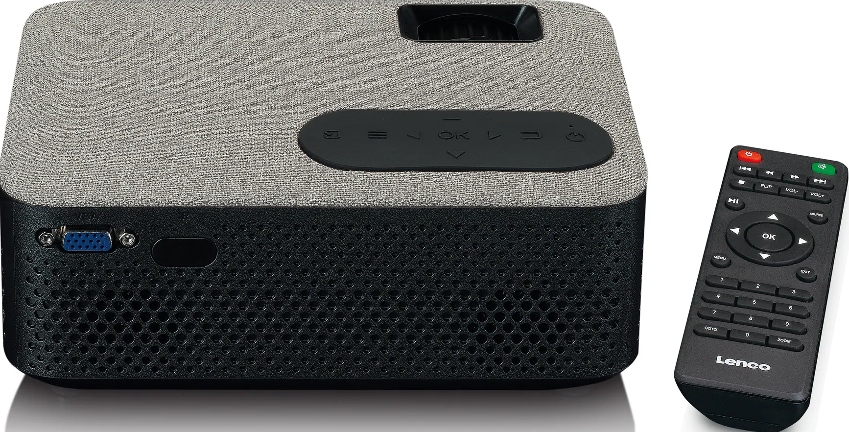 Un projecteur gris et noir avec une télécommande sur une surface blanche.