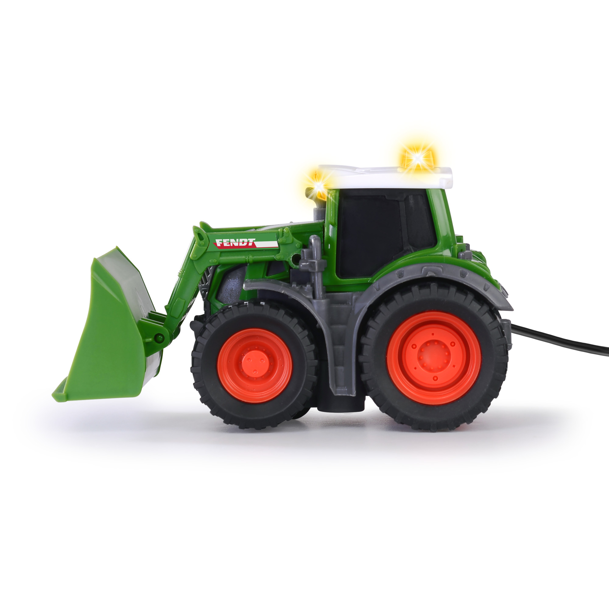 Grüner FENDT Spielzeugtraktor mit funktionierenden Lichtern, Frontansicht auf weißem Hintergrund.