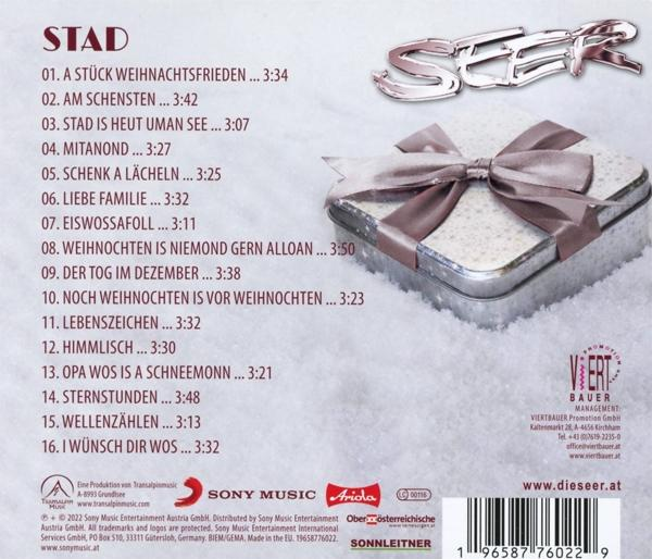 CD-Cover mit einer silbernen Geschenkbox und Trackliste.
