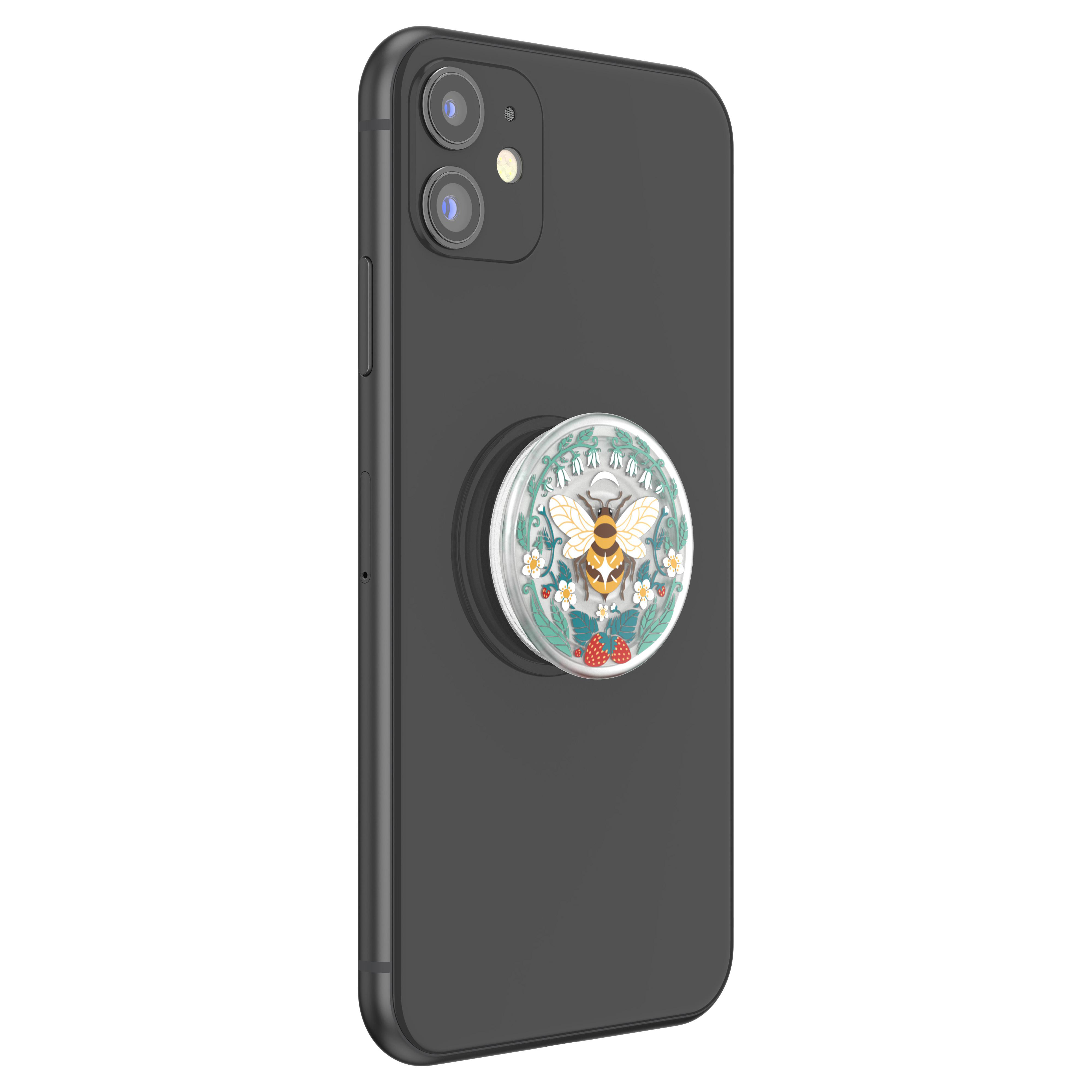 Ein schwarzes Telefon mit einem PopSocket im Bienendesign, das eine Biene, Blumen und Erdbeeren zeigt.