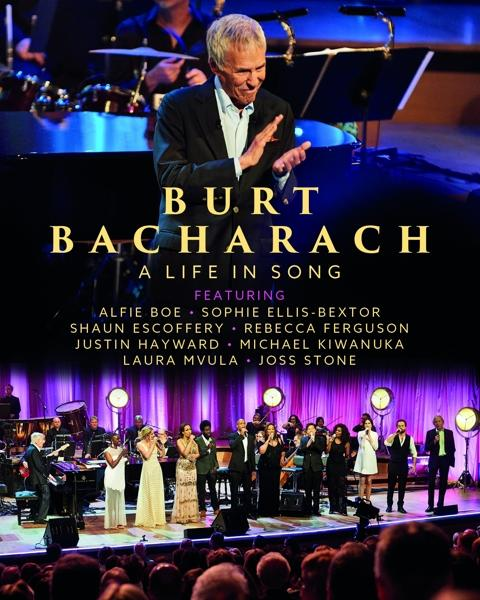 Koncertplakát Burt Bacharach-kal és egy színpaddal, előadókkal.