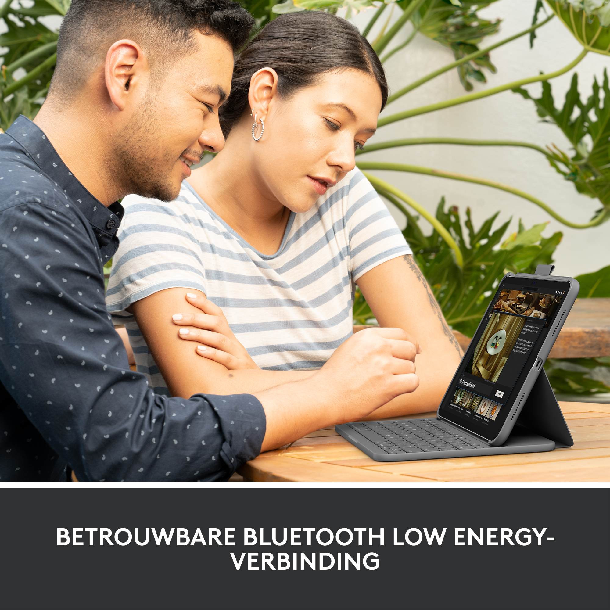 Two people are using a tablet with a keyboard. Text: Reliable Bluetooth connection.