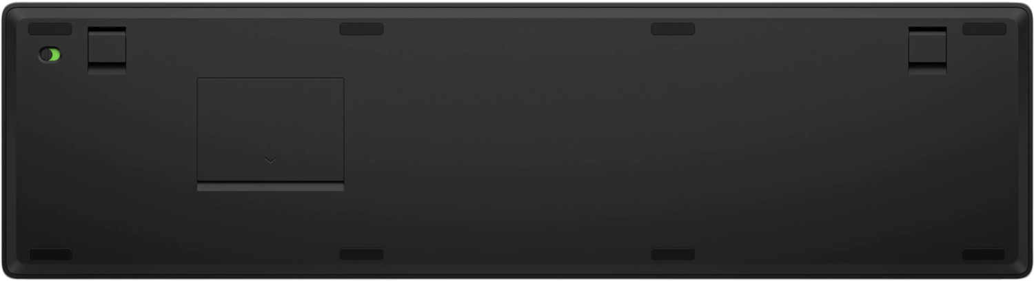 Bottom view of a black keyboard. It has black keys, and a rectangular panel on the bottom.