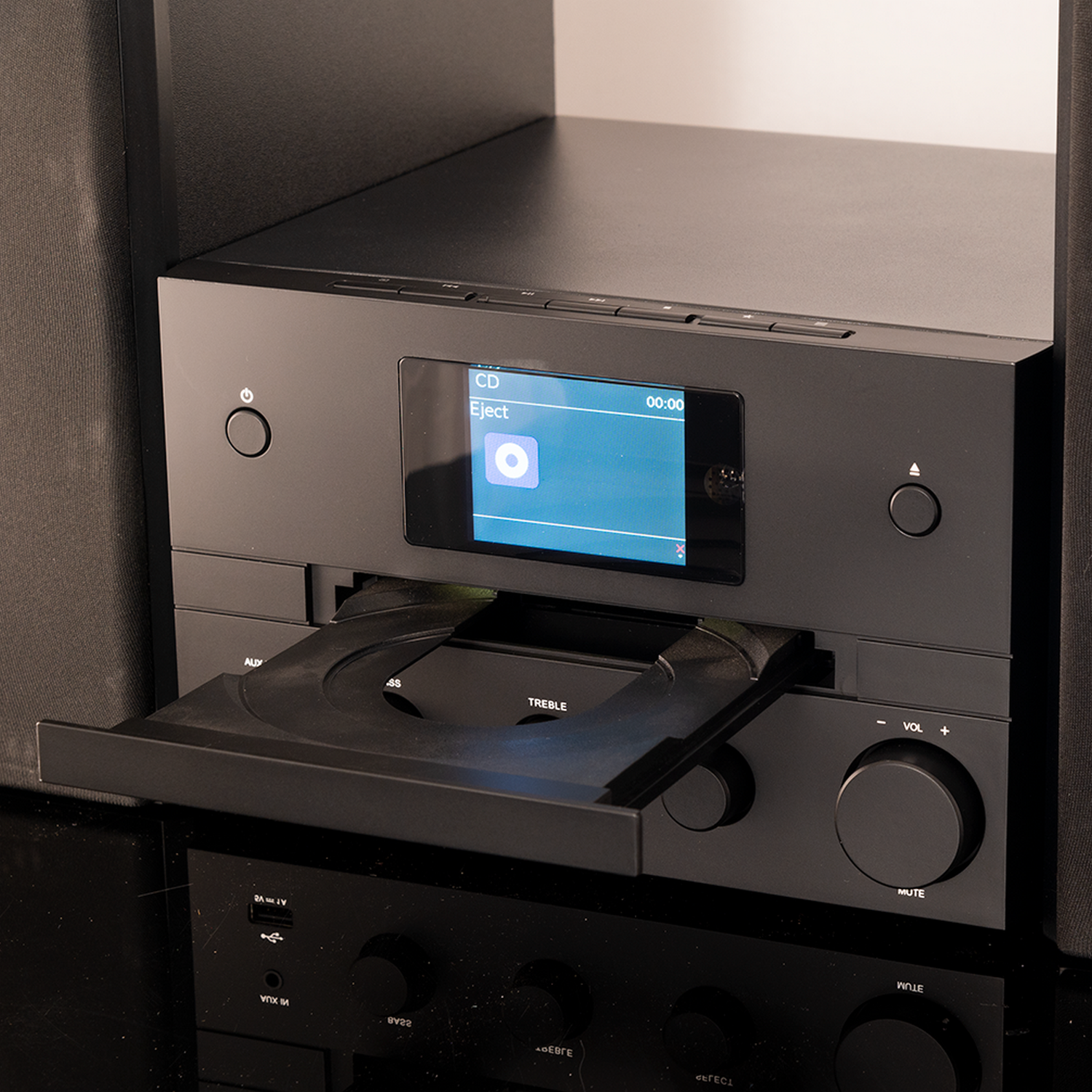 Black stereo system with a CD tray open and a CD visible on screen.