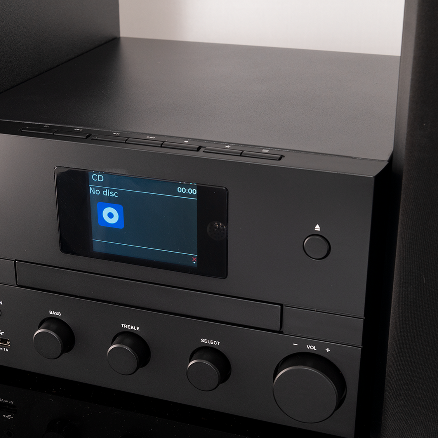 A black stereo system, showing the CD player, a screen, and a control panel.