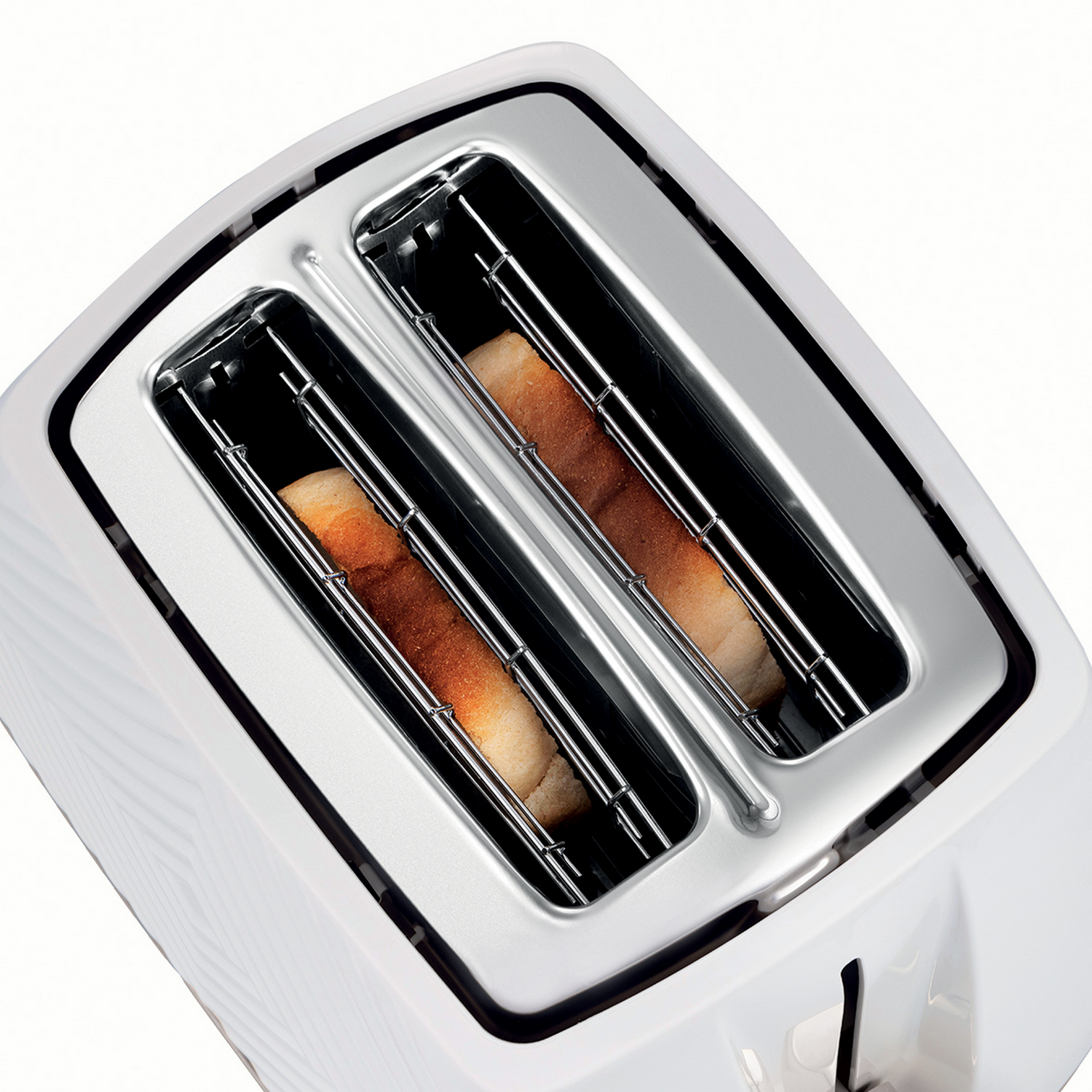 White toaster with two slots, containing toasted bread. Top-down view on white background.