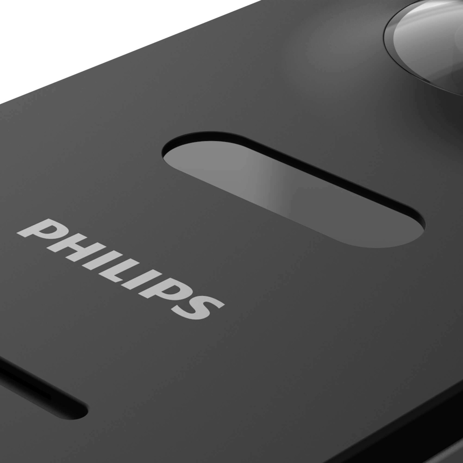 Black device with 'PHILIPS' text. Has a cutout and a lens on top.