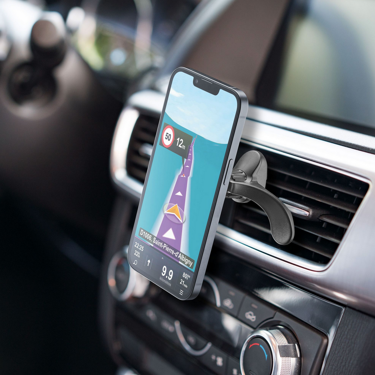 Smartphone mounted in a car's air vent, displaying a navigation app.