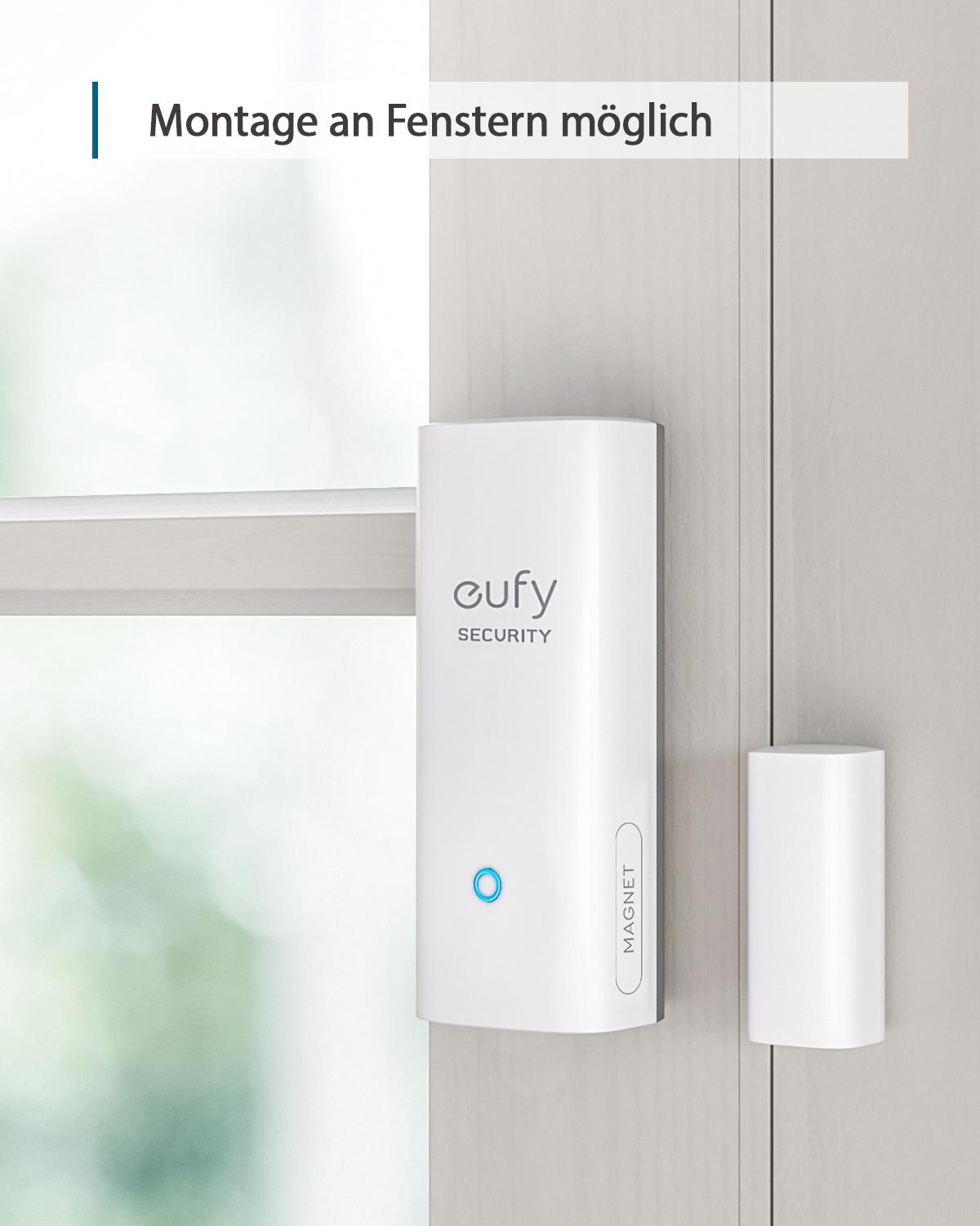 Weißes Sicherheitssensorsystem an einem Türrahmen.
