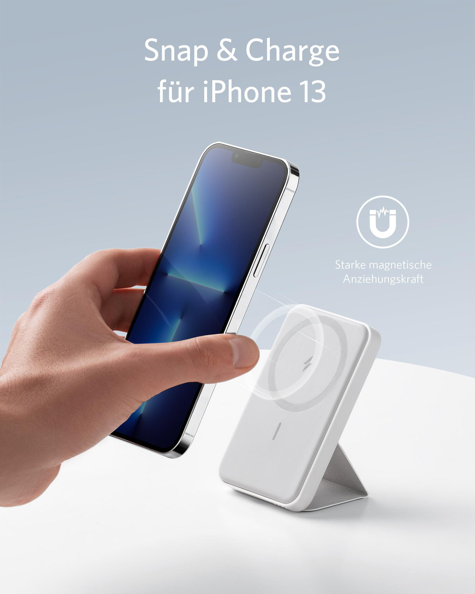 Eine Hand hält ein Telefon in der Nähe eines weißen magnetischen Ladegeräts. Text: 'Snap & Charge'.