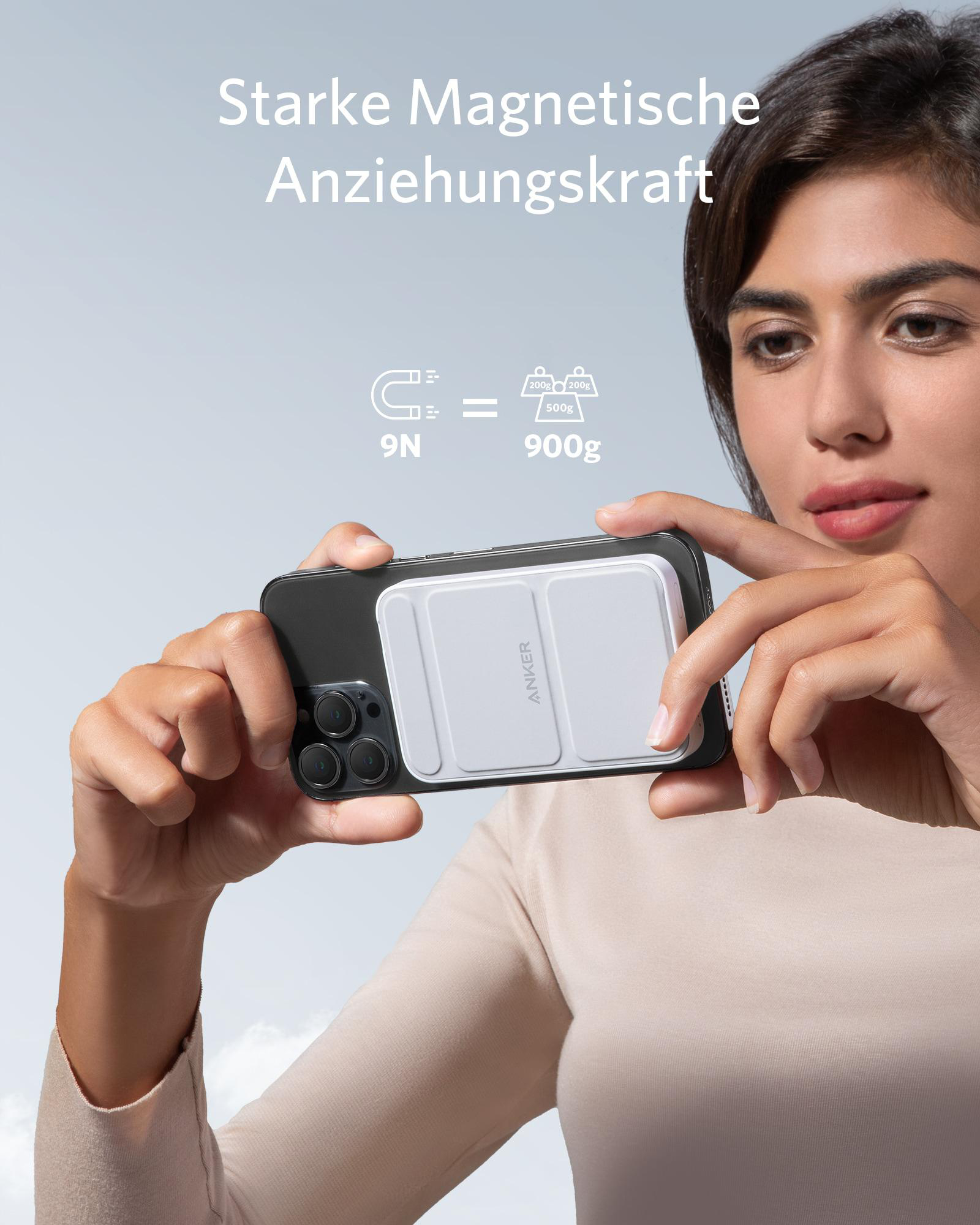 Eine Frau hält ein Telefon mit einem weißen magnetischen Ladegerät. Text besagt 9N entspricht 900g, wirbt für starke Magnetkraft.