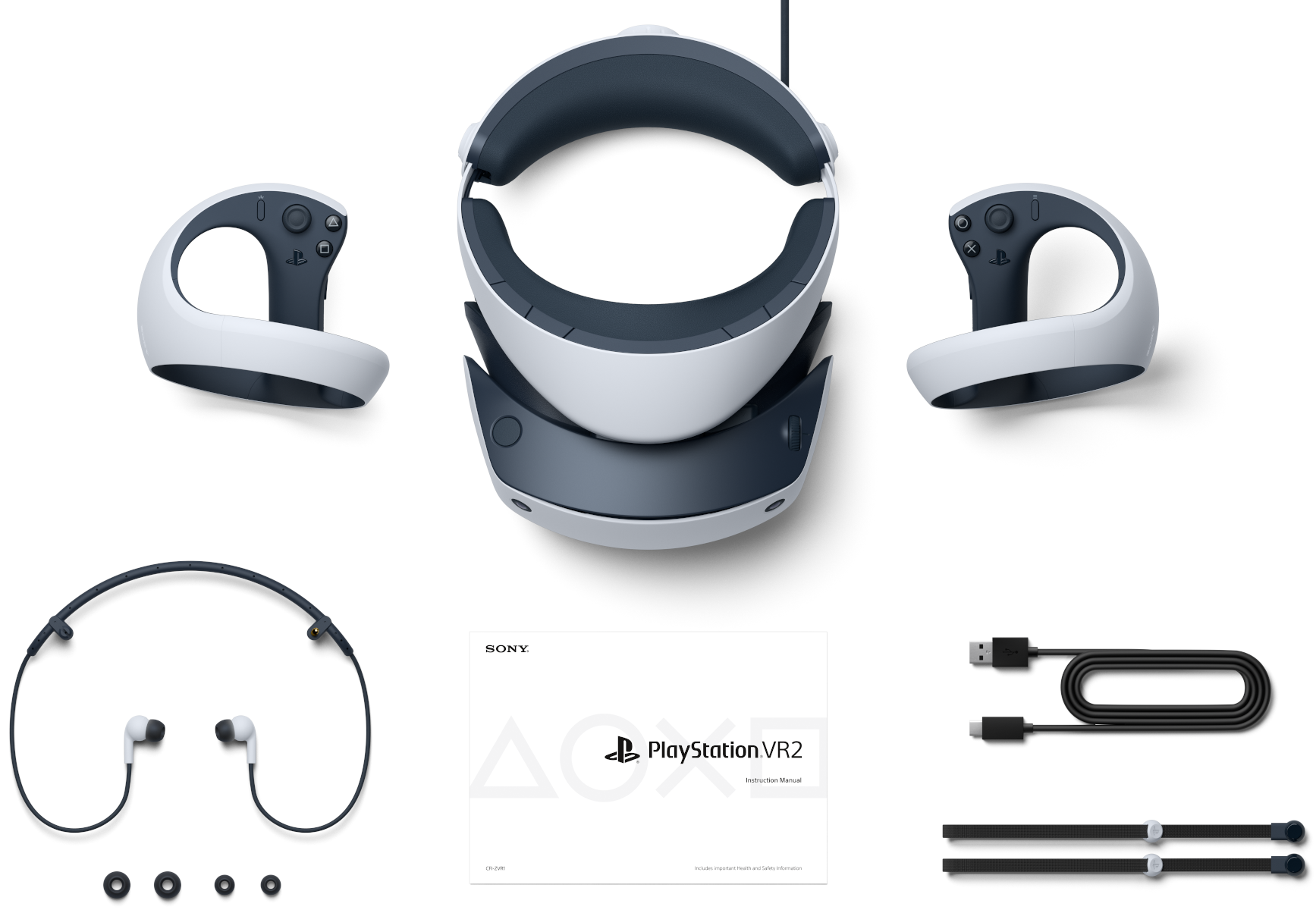 Fehér VR headset és kontrollerek, kiegészítőkkel egy fehér felületen.