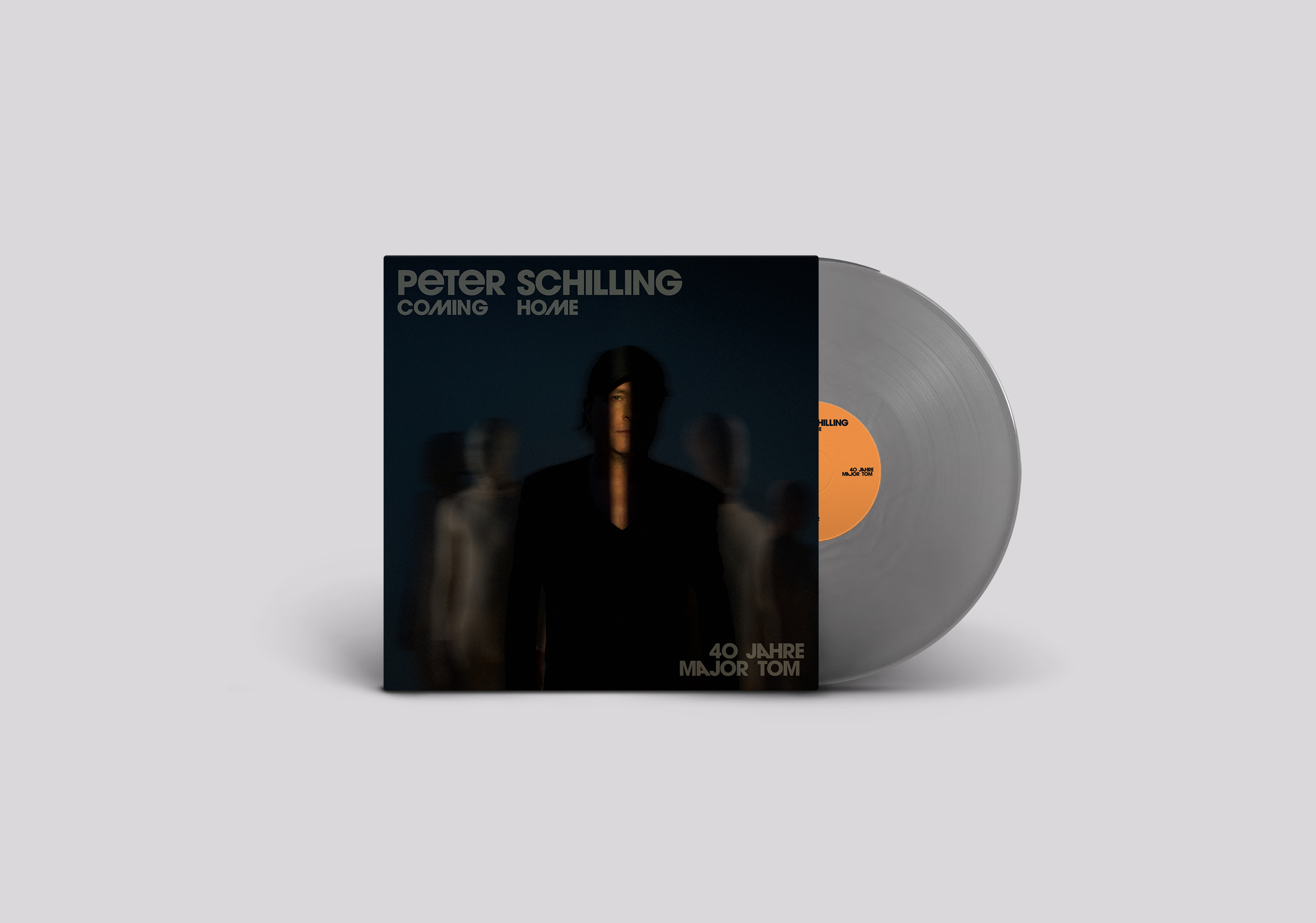 Albumcover für Peter Schillings 'Coming Home' mit einer Vinyl-Schallplatte.