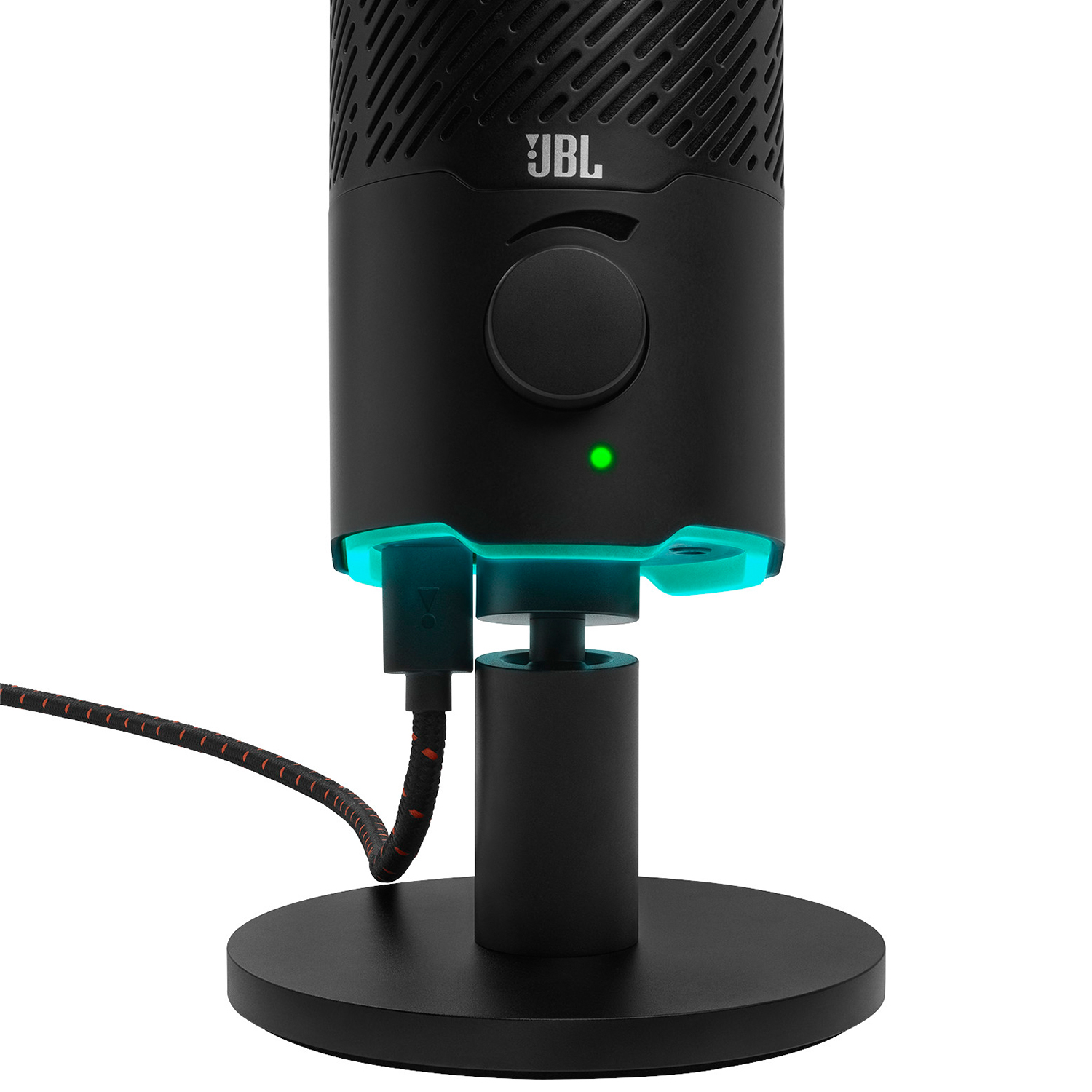 Microfono JBL nero con manopola del volume. Una luce verde è accesa. Il microfono è su un supporto.
