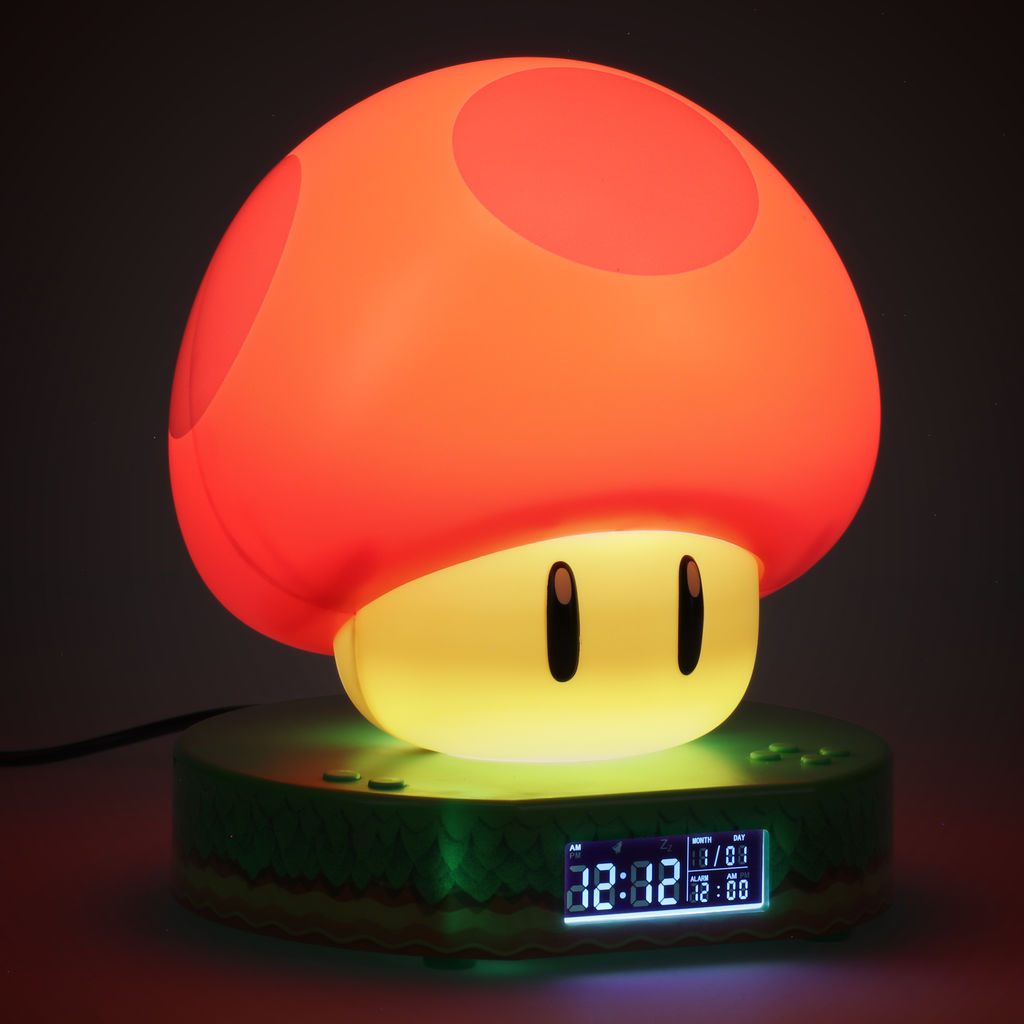Eine Mario-Pilzlampe mit rotem Oberteil, gelbem Sockel und Digitaluhr.