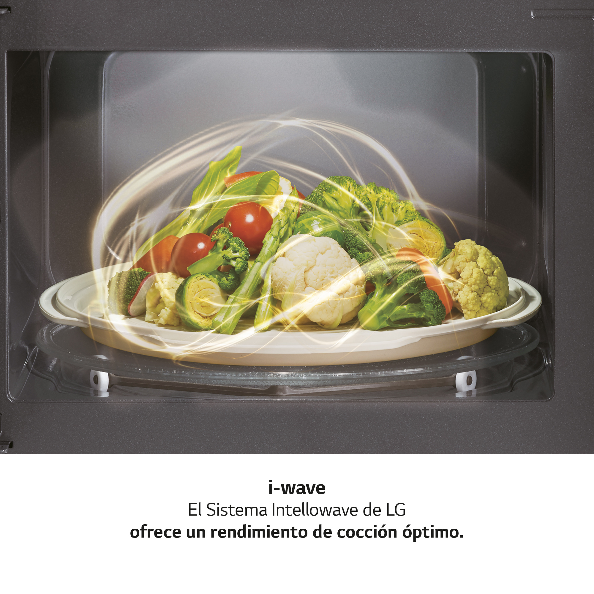 Interior del microondas con verduras en un plato. Texto sobre la tecnología i-wave.