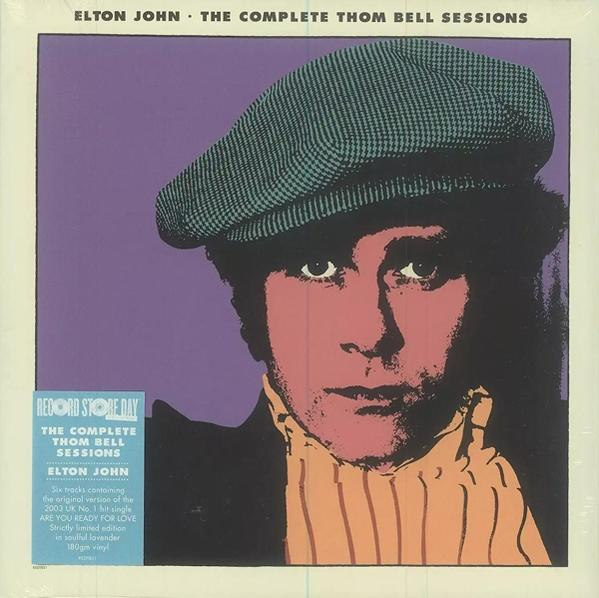 Elton John album borítója. Sapkát és kabátot visel. A háttér lila. Az album címe látható.