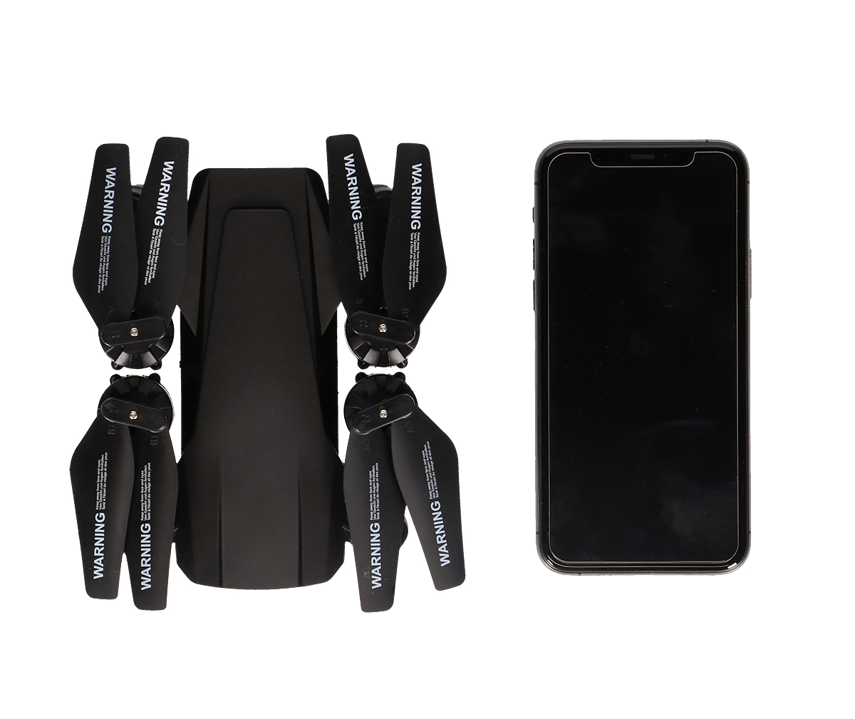 Eine schwarze Drohne und ihre Propeller neben einem Smartphone.