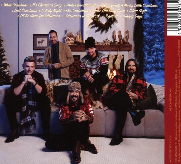 Backstreet Boys Albumcover. Fünf Männer sitzen. Weihnachtsthema mit Kamin und Dekorationen.