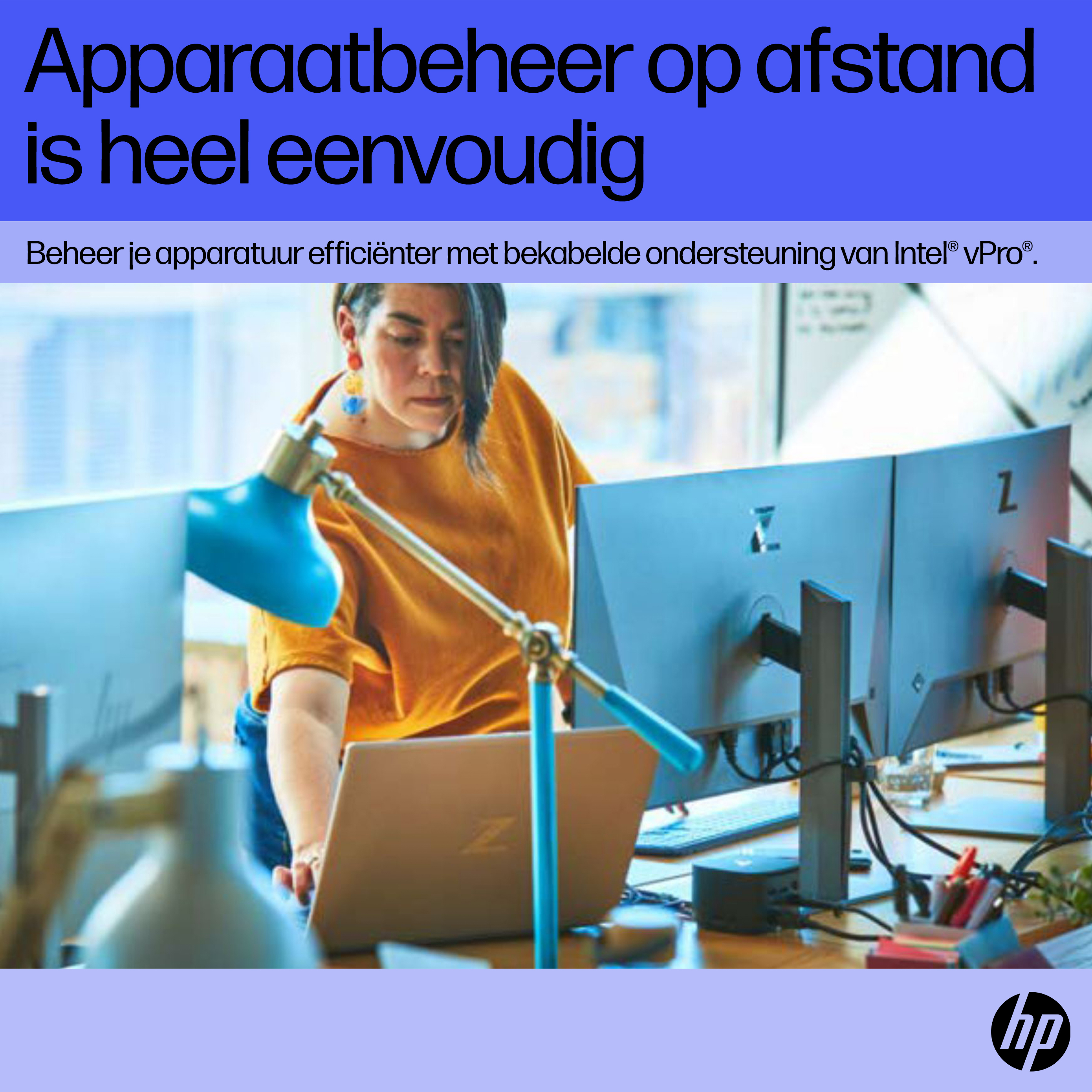 Woman working on a laptop with multiple monitors in an office setting, with HP logo.