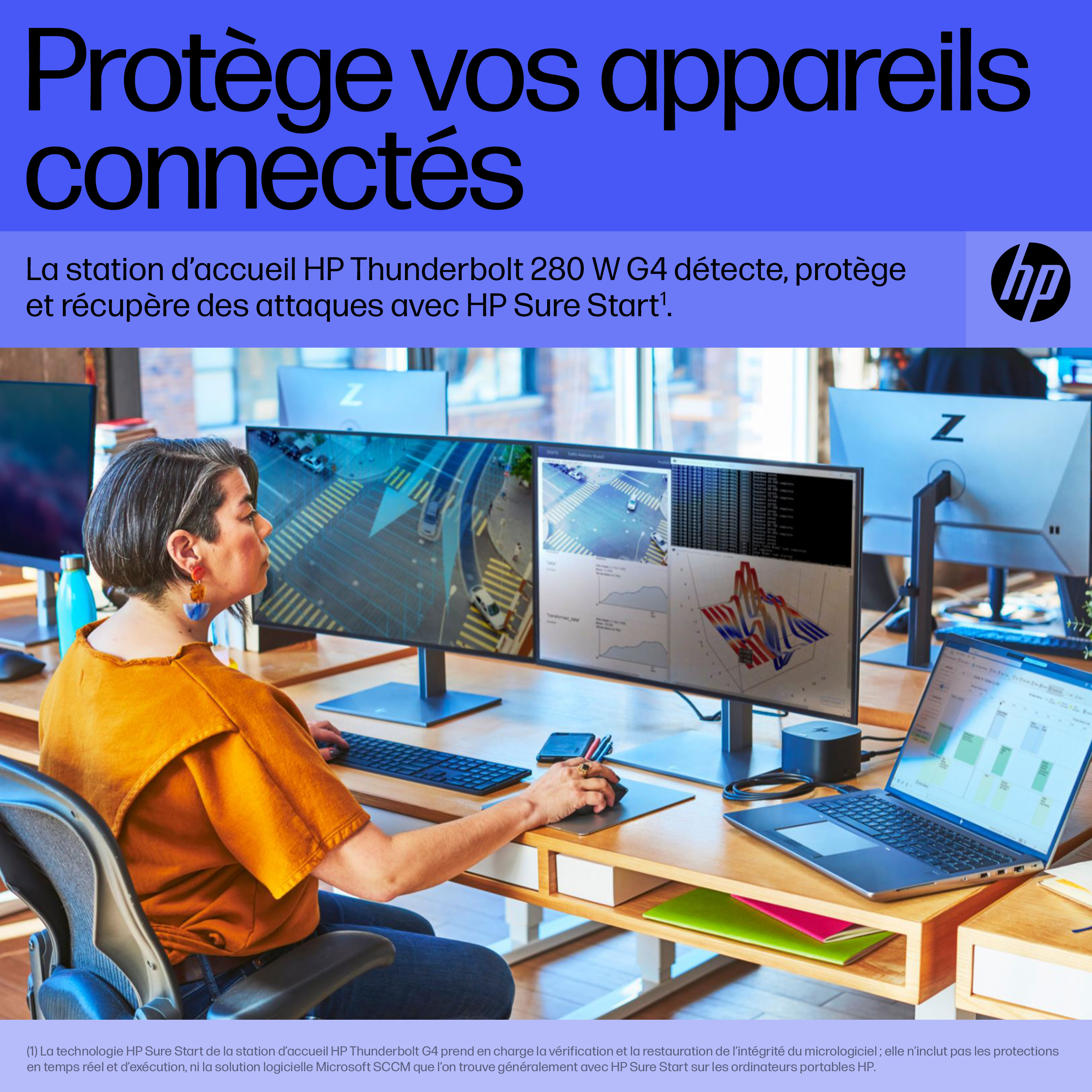 Woman working on a laptop and two monitors. Displays a desk setup with a monitor.