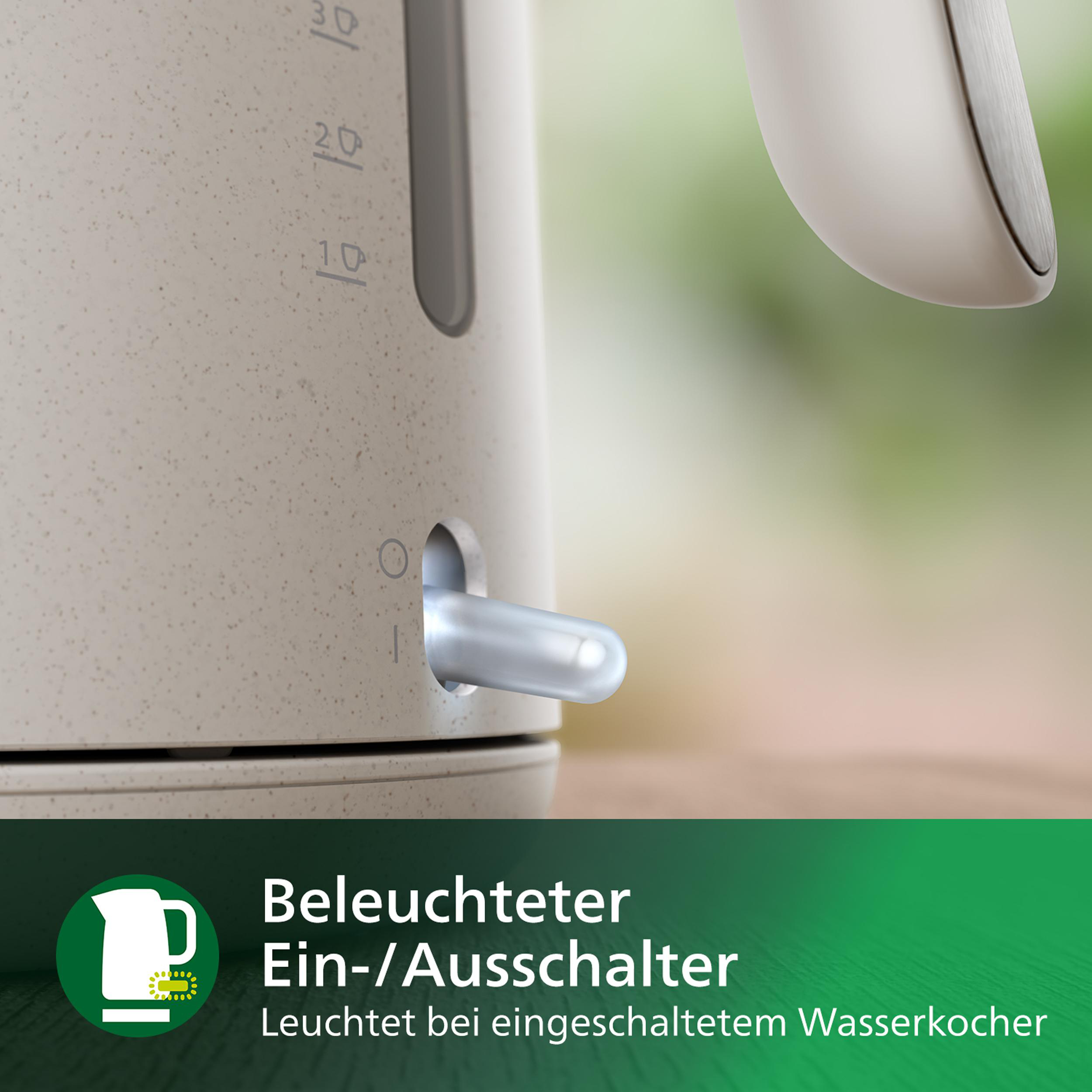 Nahaufnahme eines cremefarbenen Wasserkochers mit sichtbarem beleuchteten Ein-/Ausschalter.