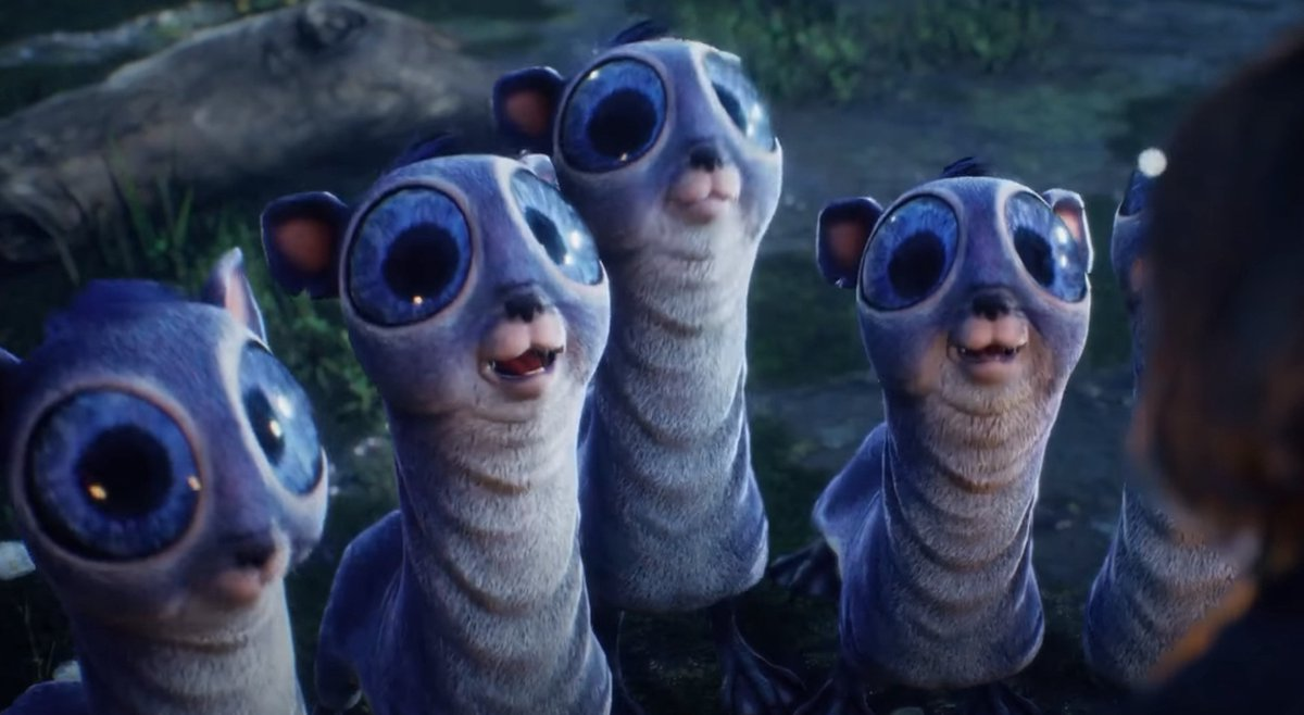 Groep blauwgrijze wezens met grote blauwe ogen, vooruitkijkend.