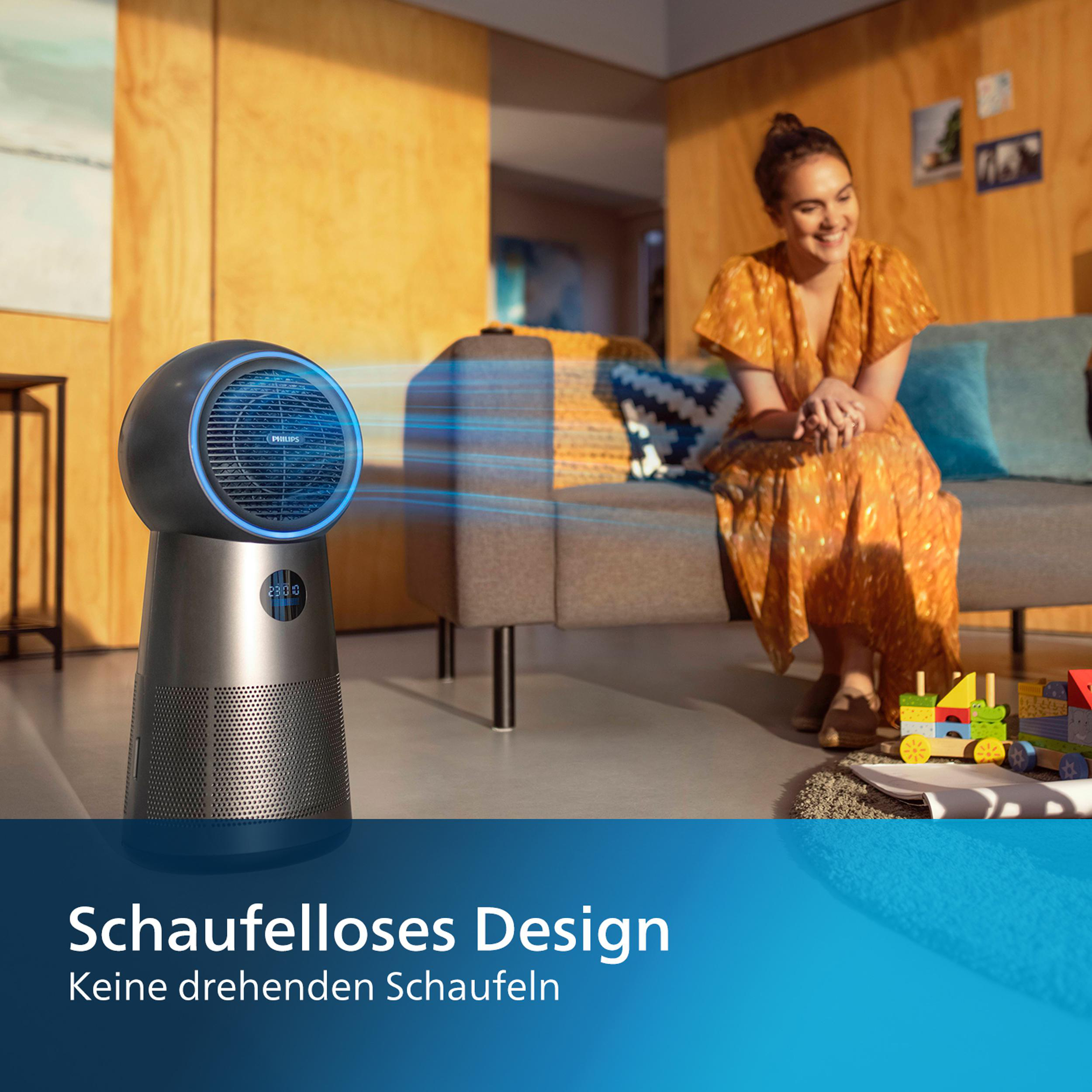 Ein Luftreiniger mit einer Frau im Hintergrund. Der Reiniger ist silber und schwarz.