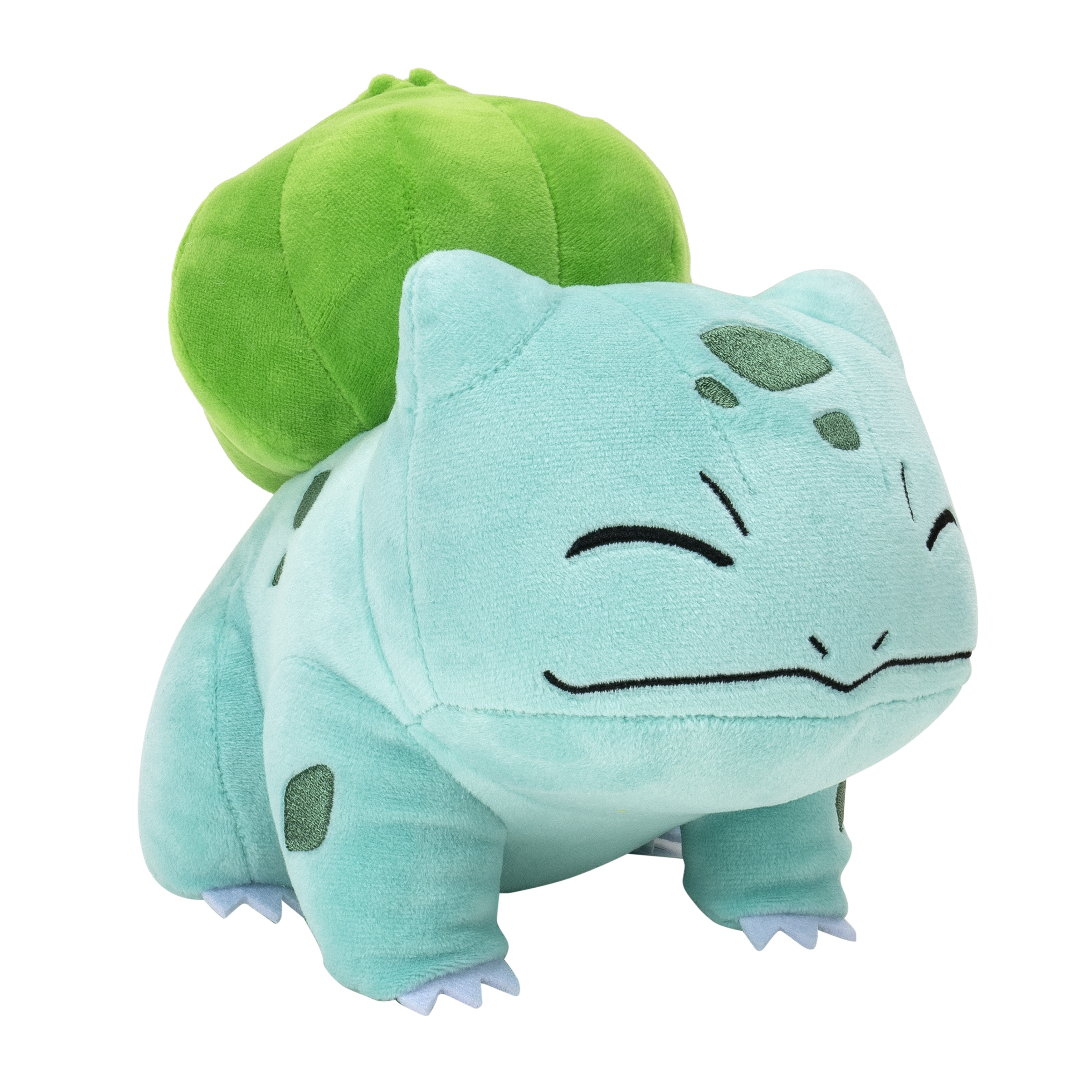 Une peluche Bulbasaur, bleu clair avec un bulbe vert sur le dos, souriant sur fond blanc.