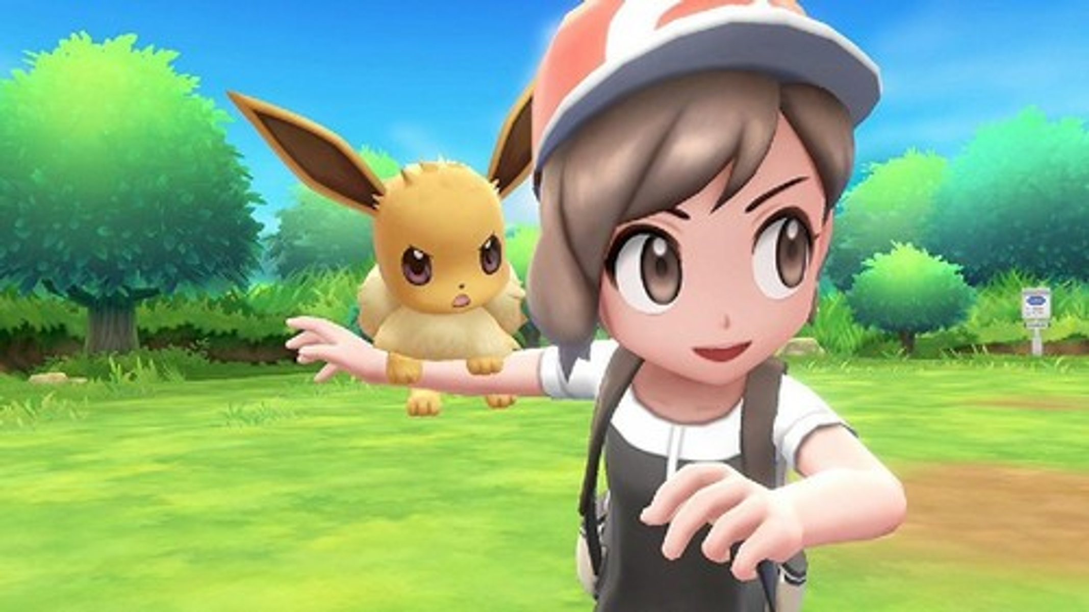 Postać z gry z dziewczyną i Pokemonem Eevee. Zielone tło z drzewami i znakiem.