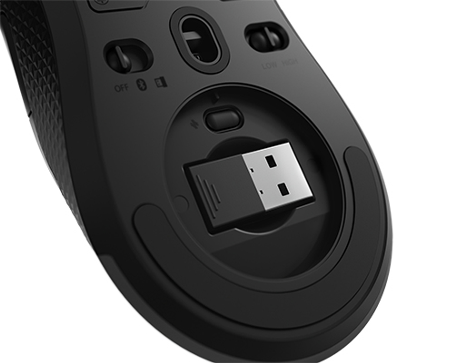 Black mouse with a USB receiver stored in a compartment on the bottom.