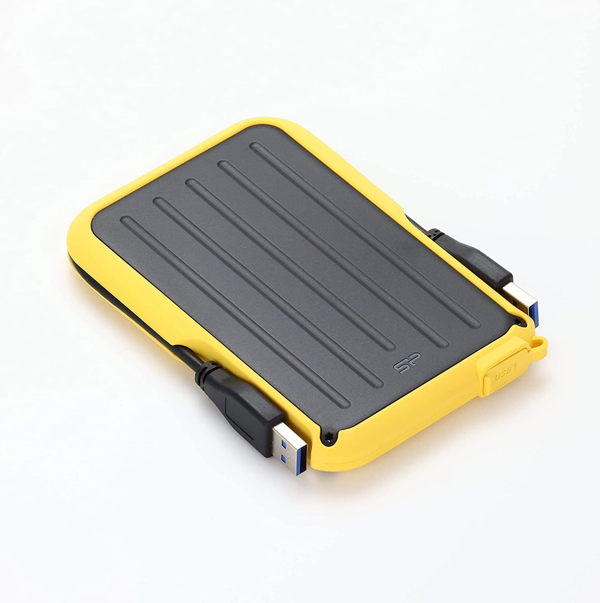 Disco duro externo amarillo con la parte superior negra. Los puertos USB son visibles.
