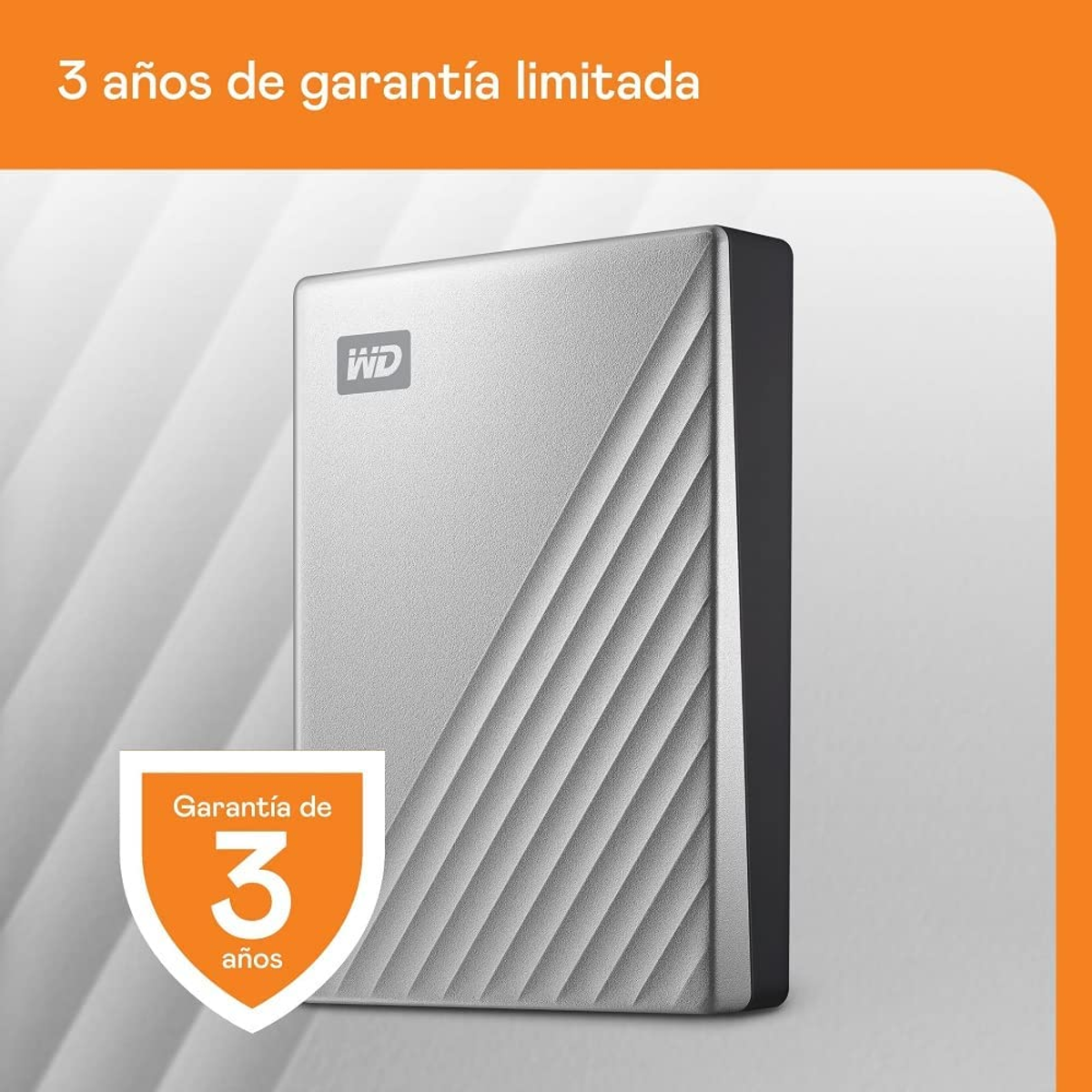 Srebrny zewnętrzny dysk twardy z przekątnymi liniami, widoczny tekst gwarancji.