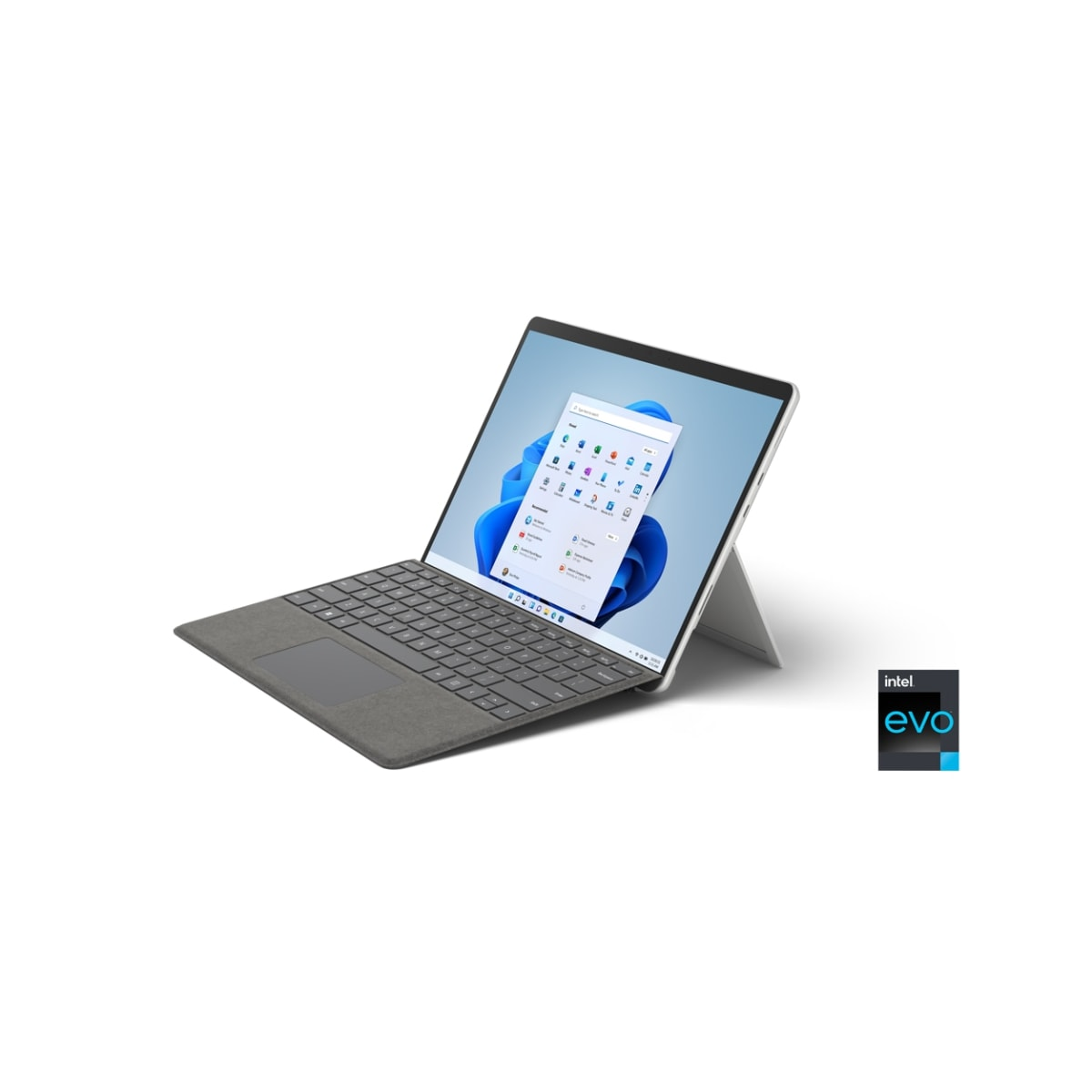 Un portátil gris con un teclado tipo tableta, abierto sobre una superficie blanca. Tiene una pantalla con la interfaz de Windows.