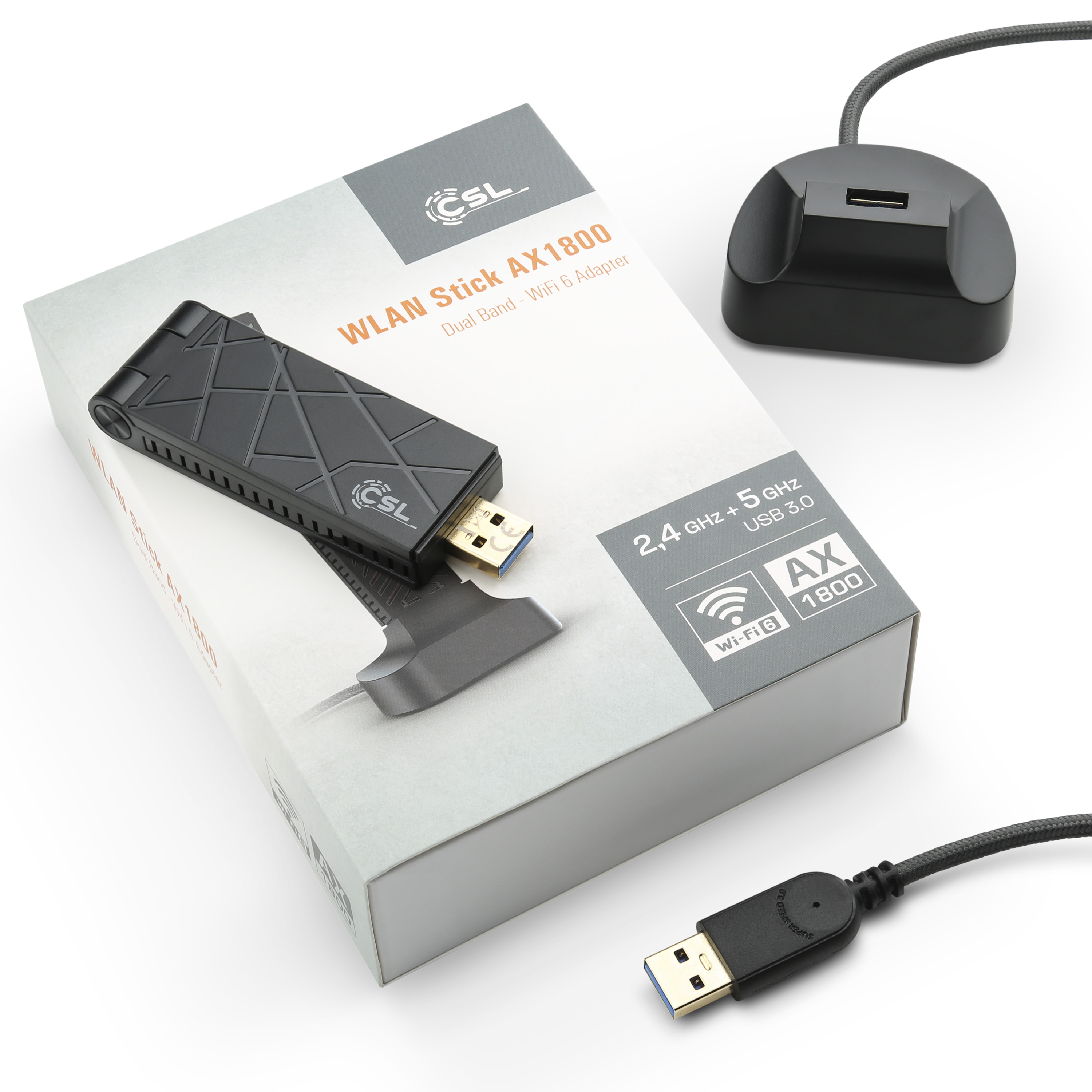 WLAN-Stick-Adapter, eine schwarze Box und ein USB-Kabel. Die Box ist weiß und schwarz.