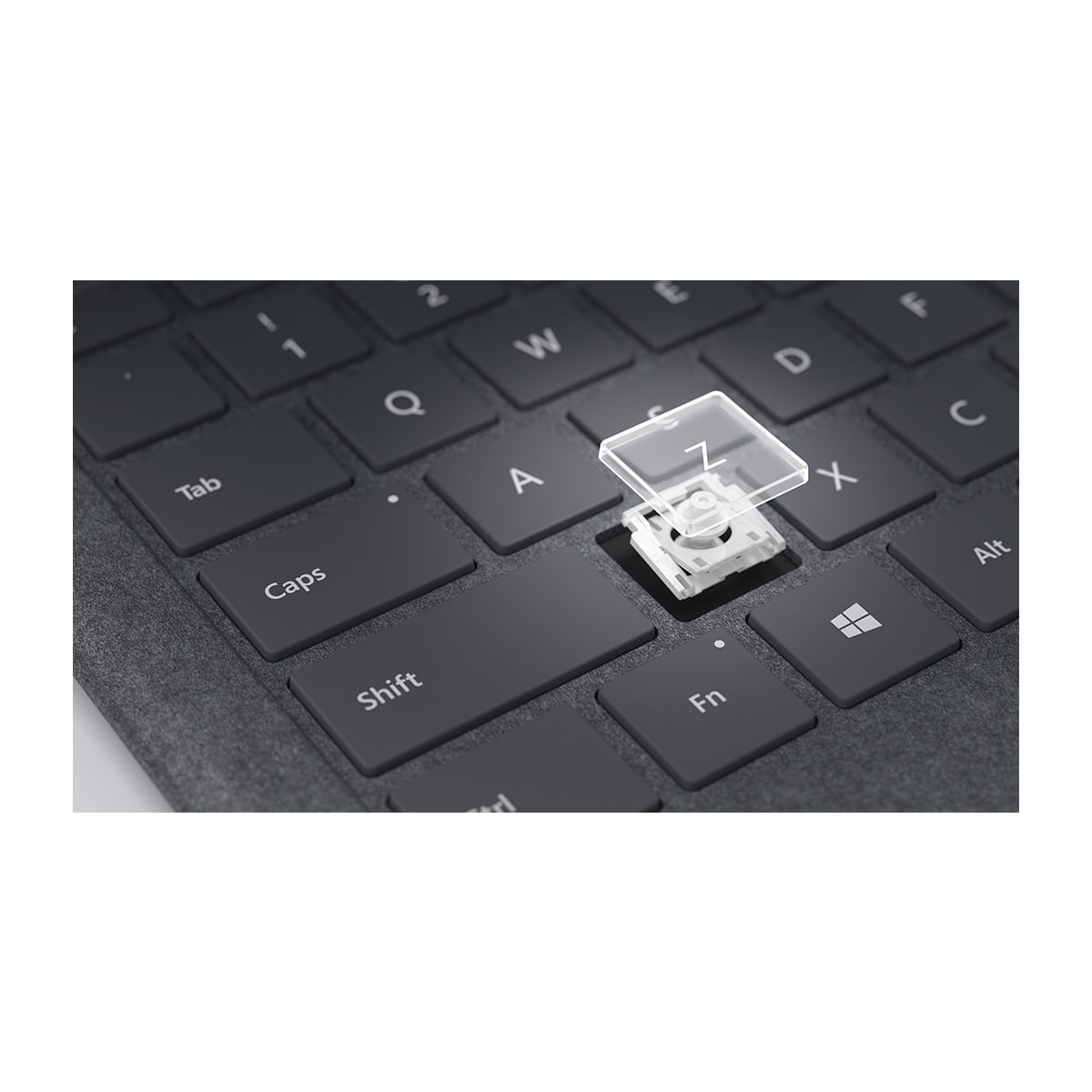 Klawisz klawiatury z przezroczystym plastikowym wierzchem. Widoczny klawisz Z, z białym mechanizmem.