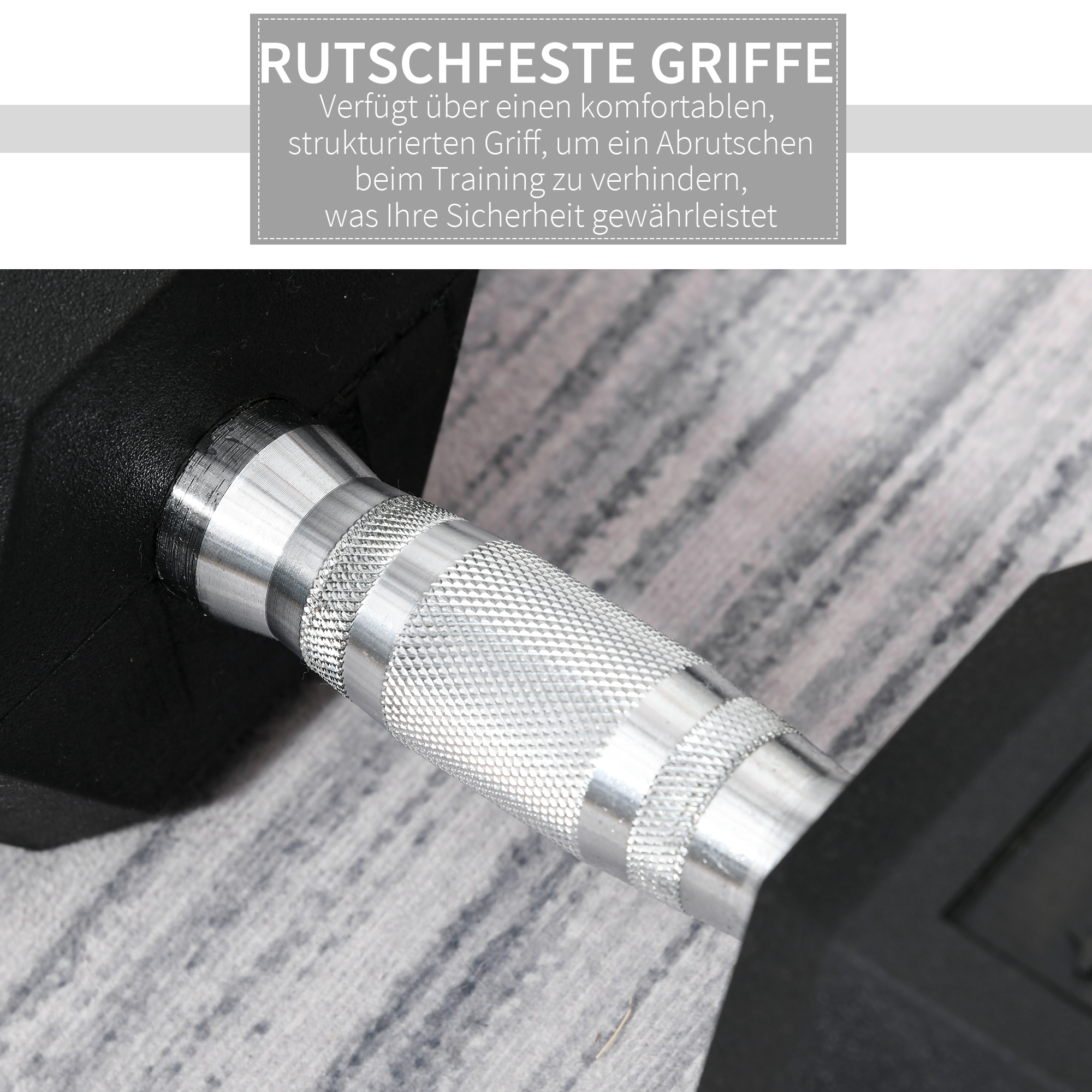 Nahaufnahme einer schwarzen Hantel mit silbernem Griff auf strukturierter Oberfläche. Der Hintergrund ist unscharf.