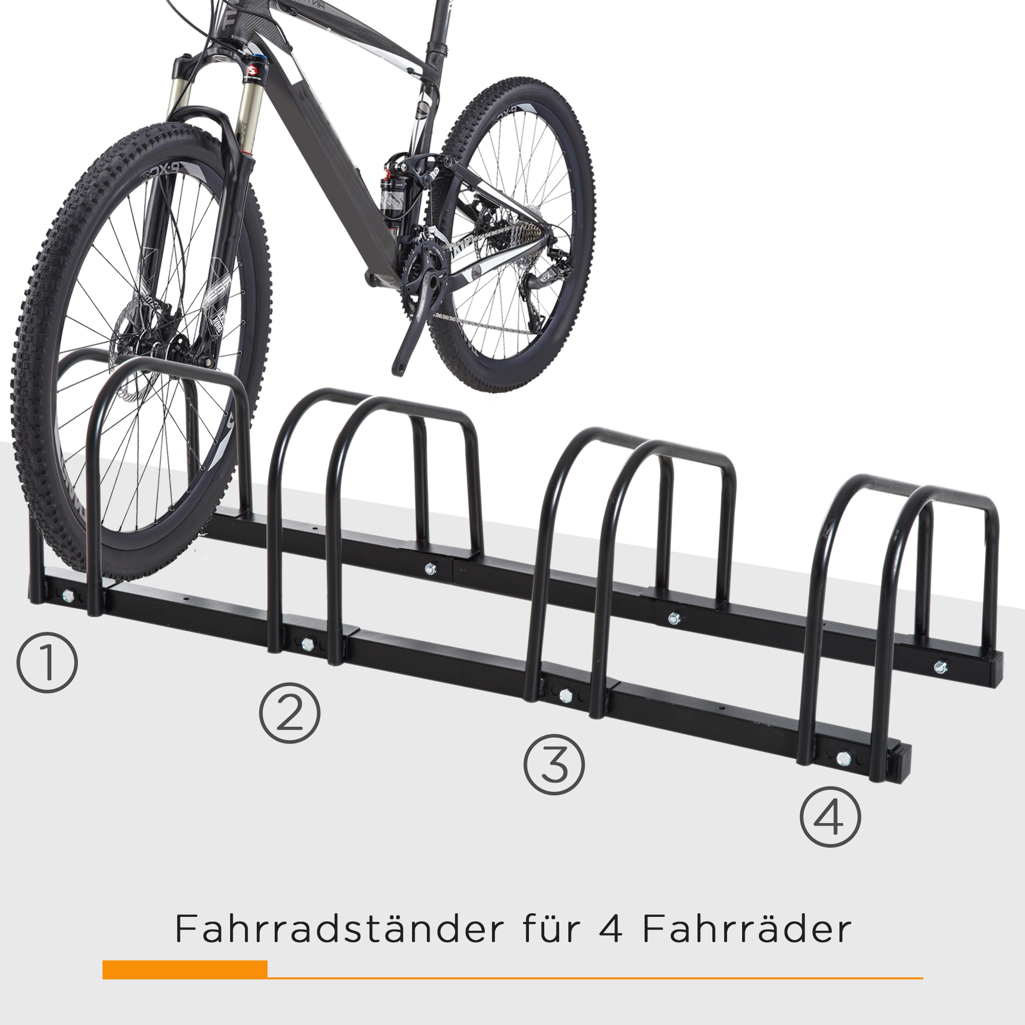 Schwarzes Fahrrad und schwarzer Fahrradständer. Der Ständer hat vier Schlitze.