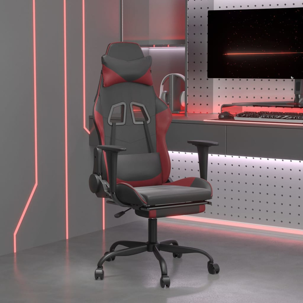 Gaming-Stuhl in modernem Ambiente. Schwarzer, roter Stuhl mit Monitor. Graue Wand im Hintergrund.