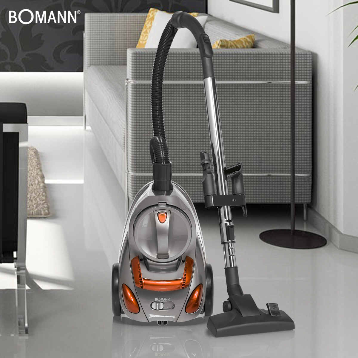 Odkurzacz. Srebrne i pomarańczowe detale. Wnętrze z światłem.