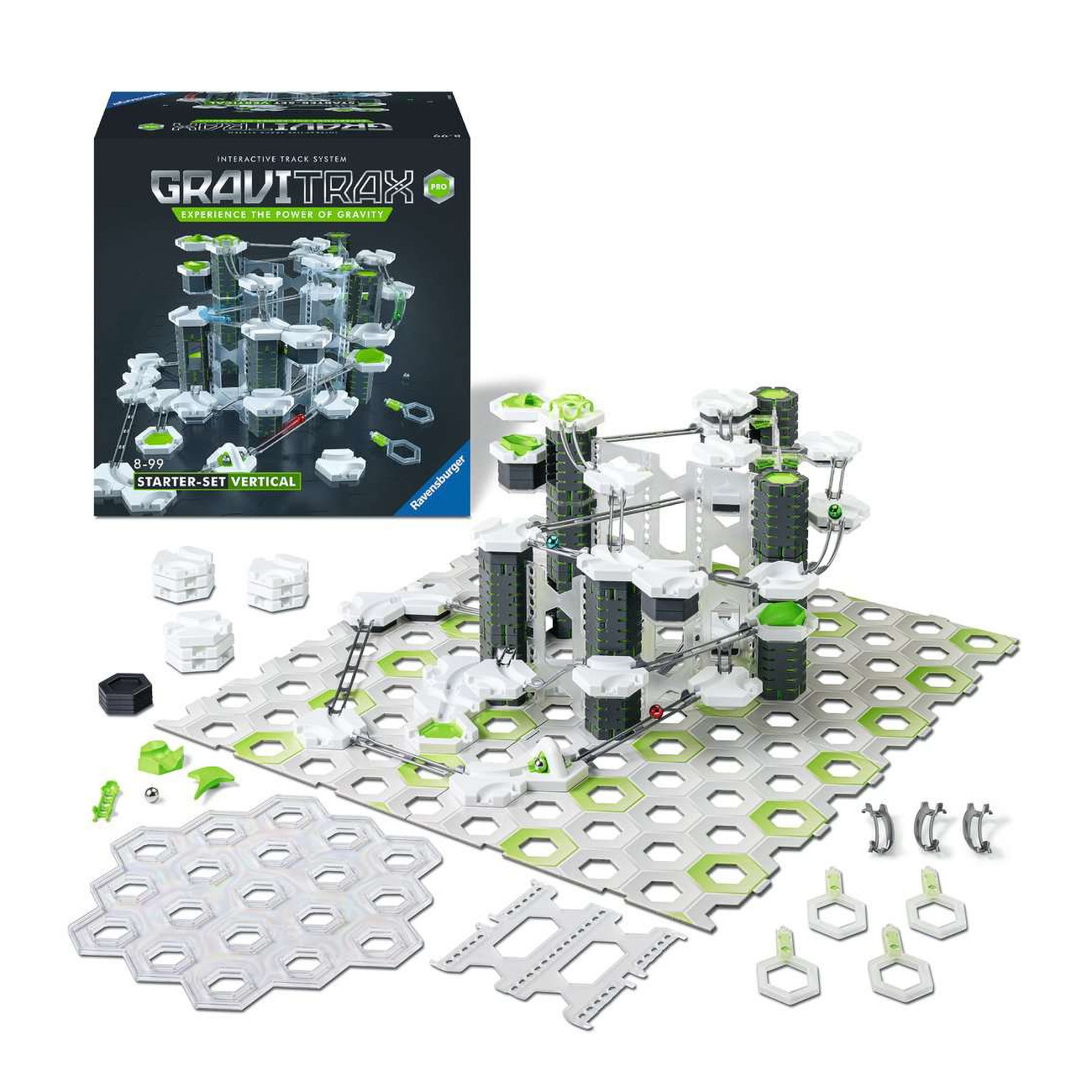 Zestaw Gravitrax z systemem torów. Pudełka, tory, kulki i pudełko na białej powierzchni.