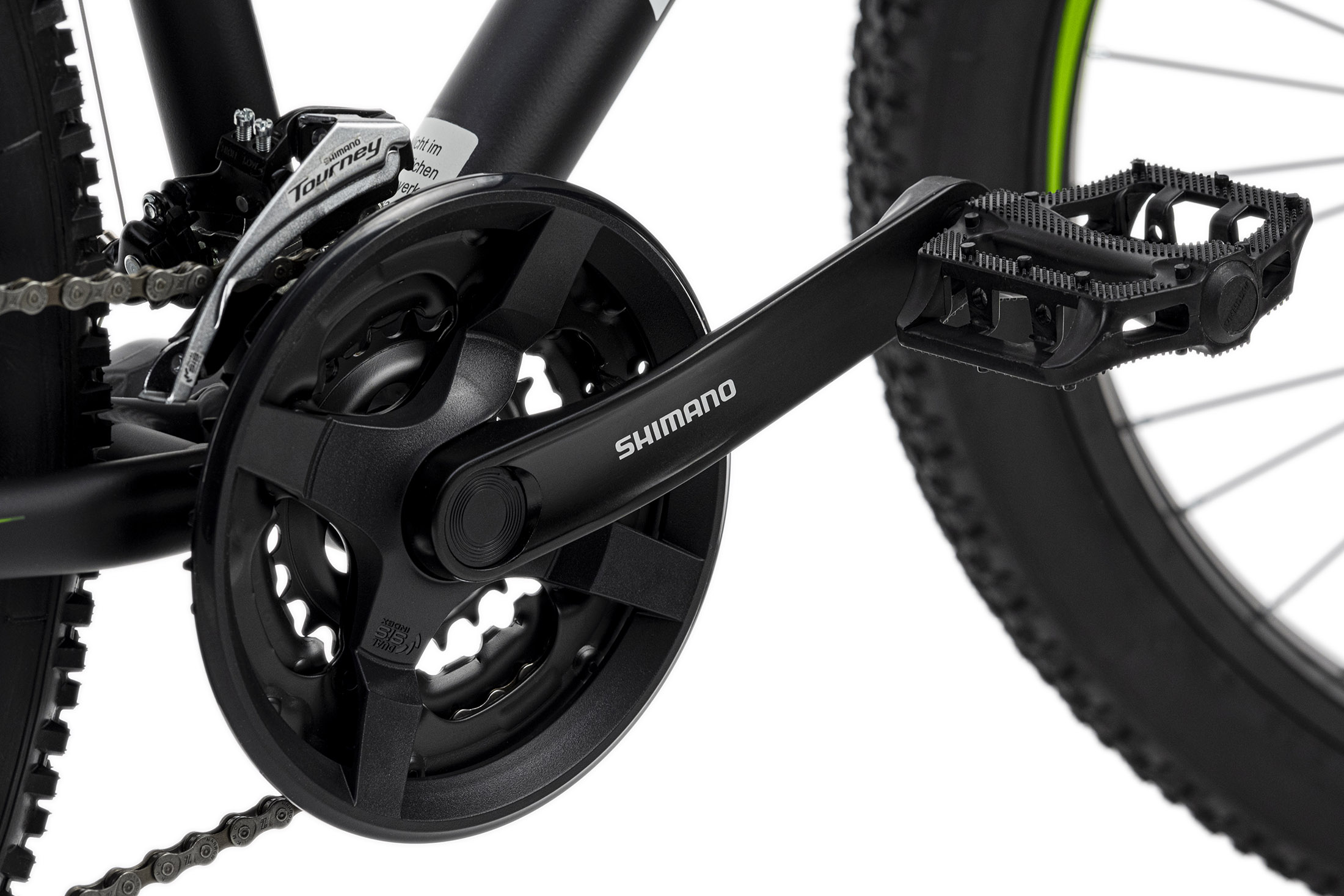Nahaufnahme eines schwarzen Shimano-Fahrradkurbelsatzes mit Shimano-Logo. Kette und Pedale sind sichtbar.