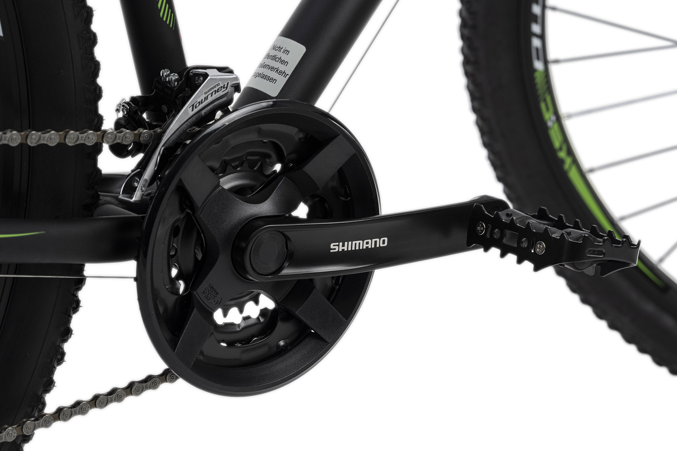 Schwarze Fahrradkurbelgarnitur mit Shimano-Logo. Kette und Reifen sichtbar.