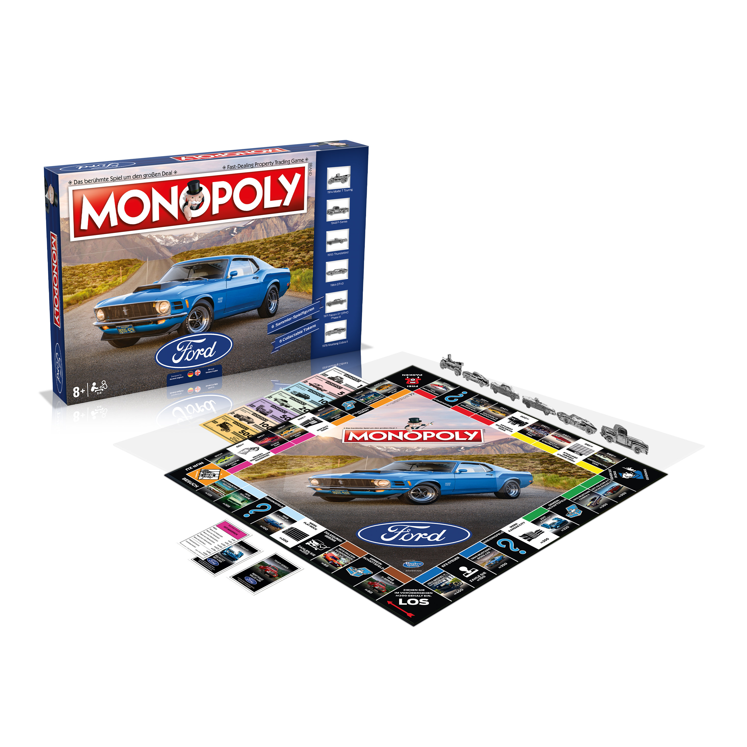 Monopoly Ford Edition Spiel. Spielbrett geöffnet, Autos, Karten, Schachtel. Blaues Auto auf dem Box-Art.