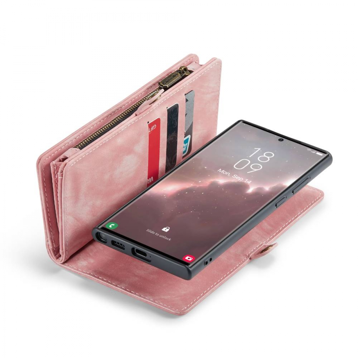 Rosafarbene Handyhülle mit Karten neben einem schwarzen Telefon auf weißer Oberfläche.