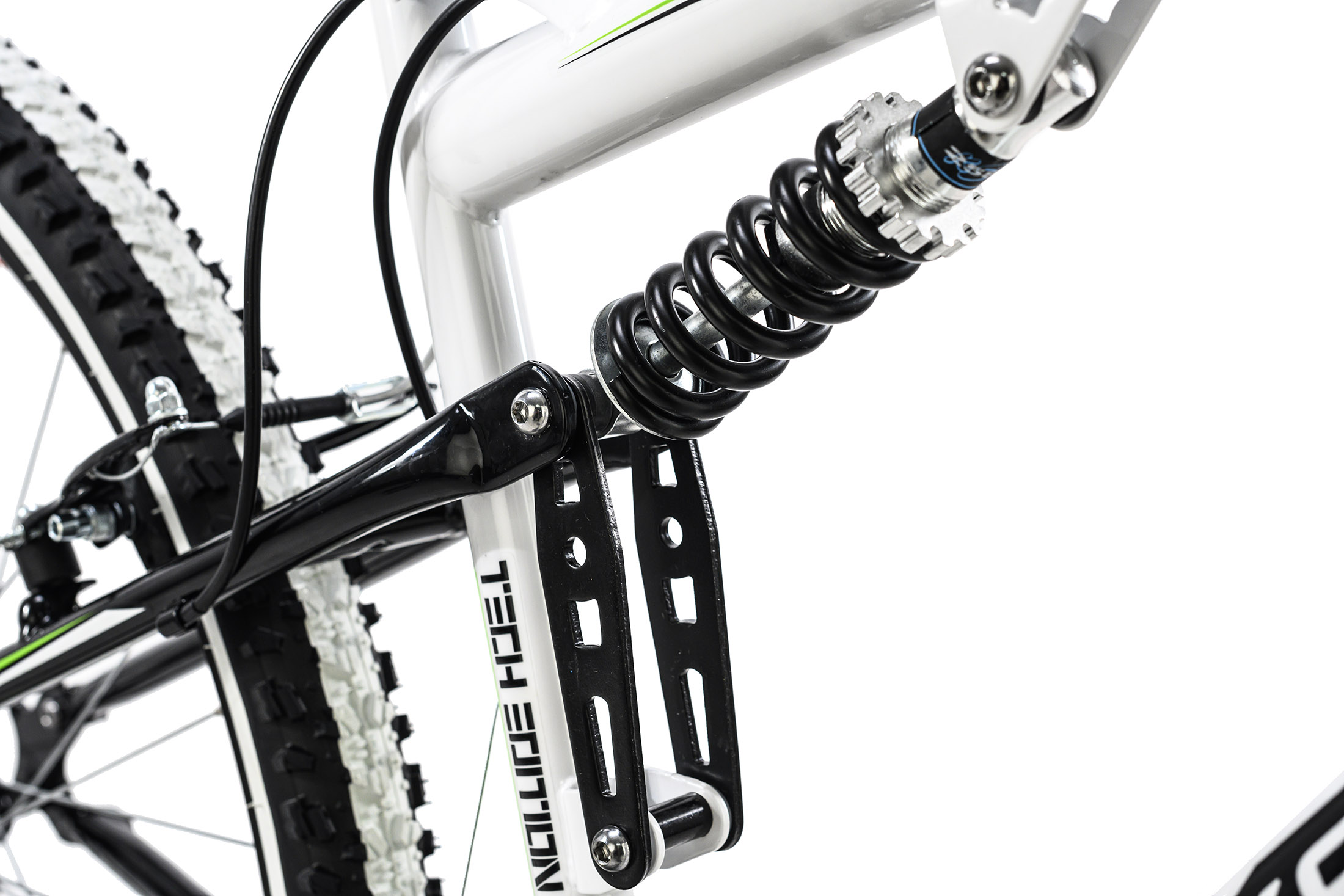 Nahaufnahme des Fahrradfederungssystems mit schwarzer Feder und weißem Rahmen. Text: Tech Edition.