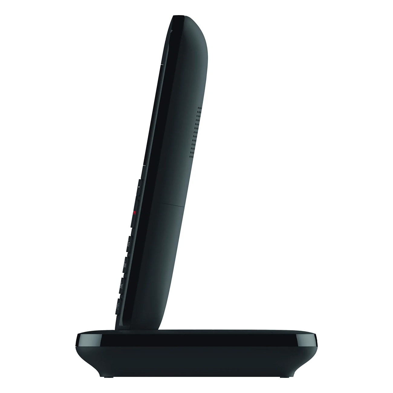 Un téléphone sans fil noir sur sa base de chargement, vue latérale.